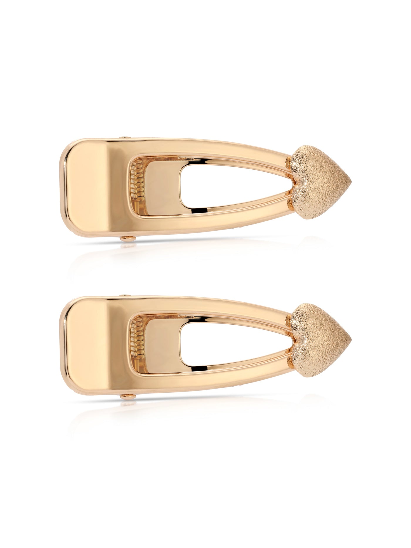 Two gold-colored hair clips are positioned side by side. They feature a sleek, elongated design with a textured, pointed end. The background is plain white, emphasizing the clips’ reflective surface.