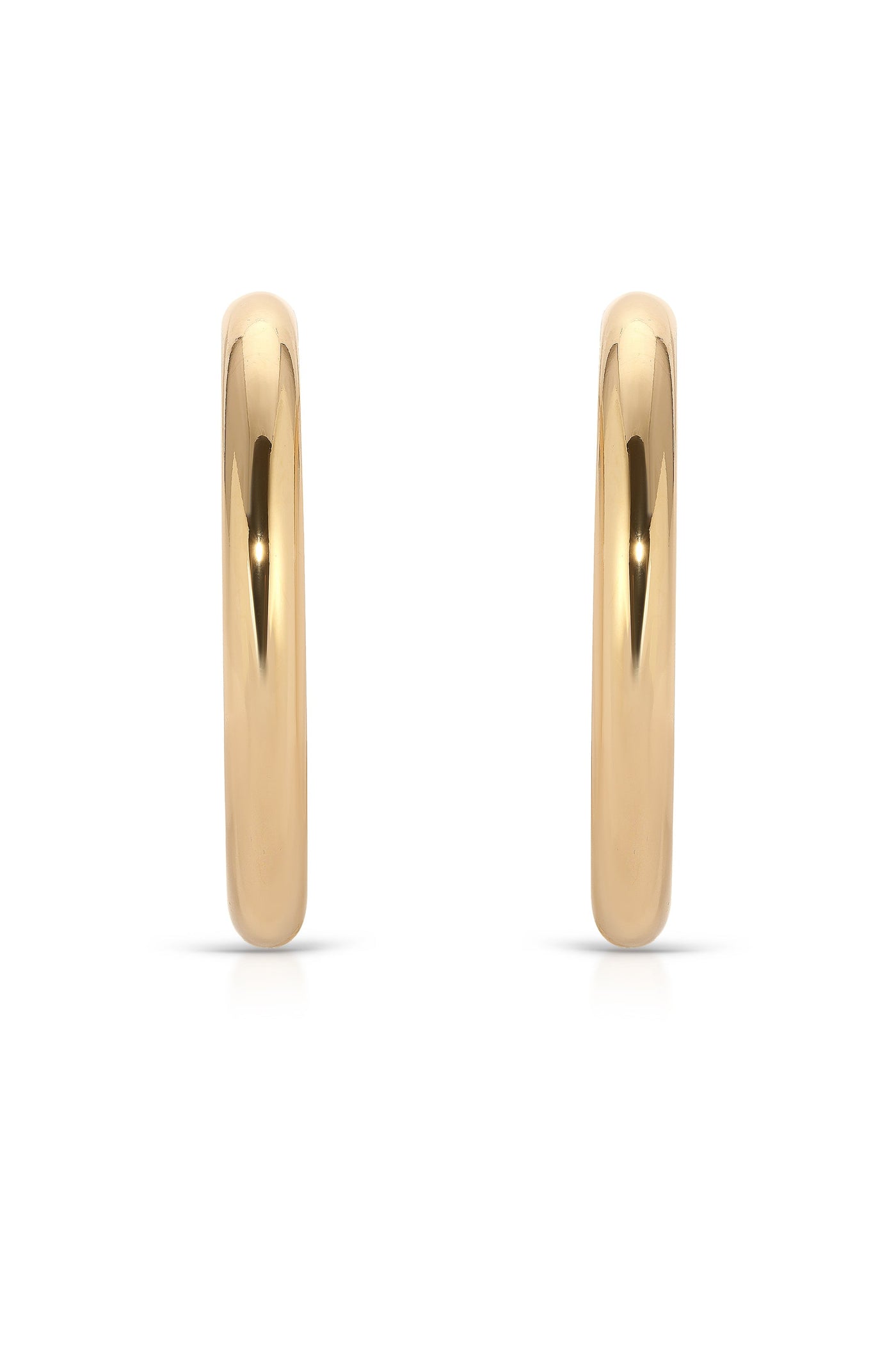 Two shiny gold hoop earrings are displayed, standing upright against a white background, highlighting their smooth surface and reflective qualities, emphasizing elegance and simplicity in design.