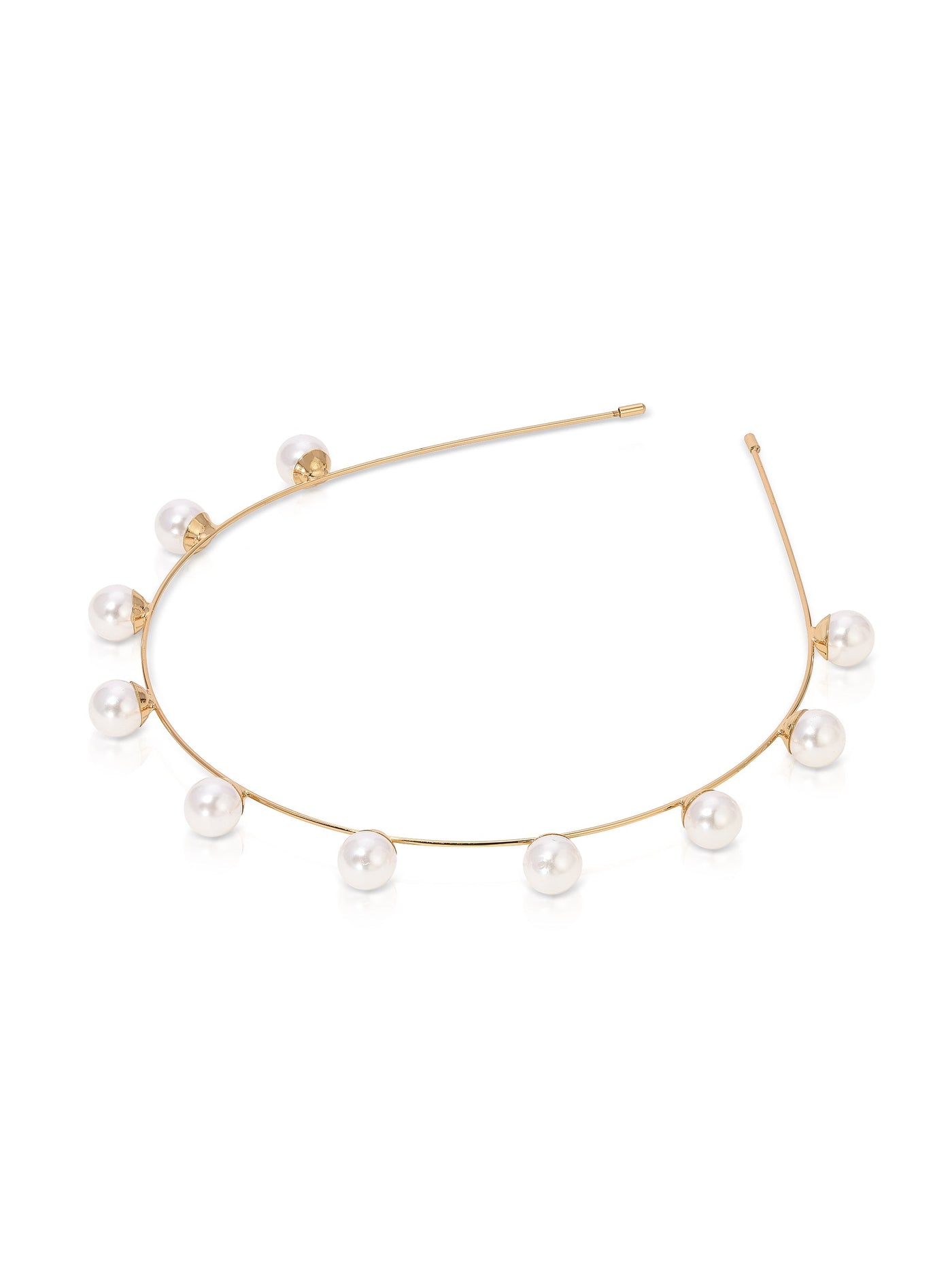 A delicate gold necklace features evenly spaced pearls adorning a slender, curved chain. It rests on a reflective white surface, highlighting its elegant and modern design.