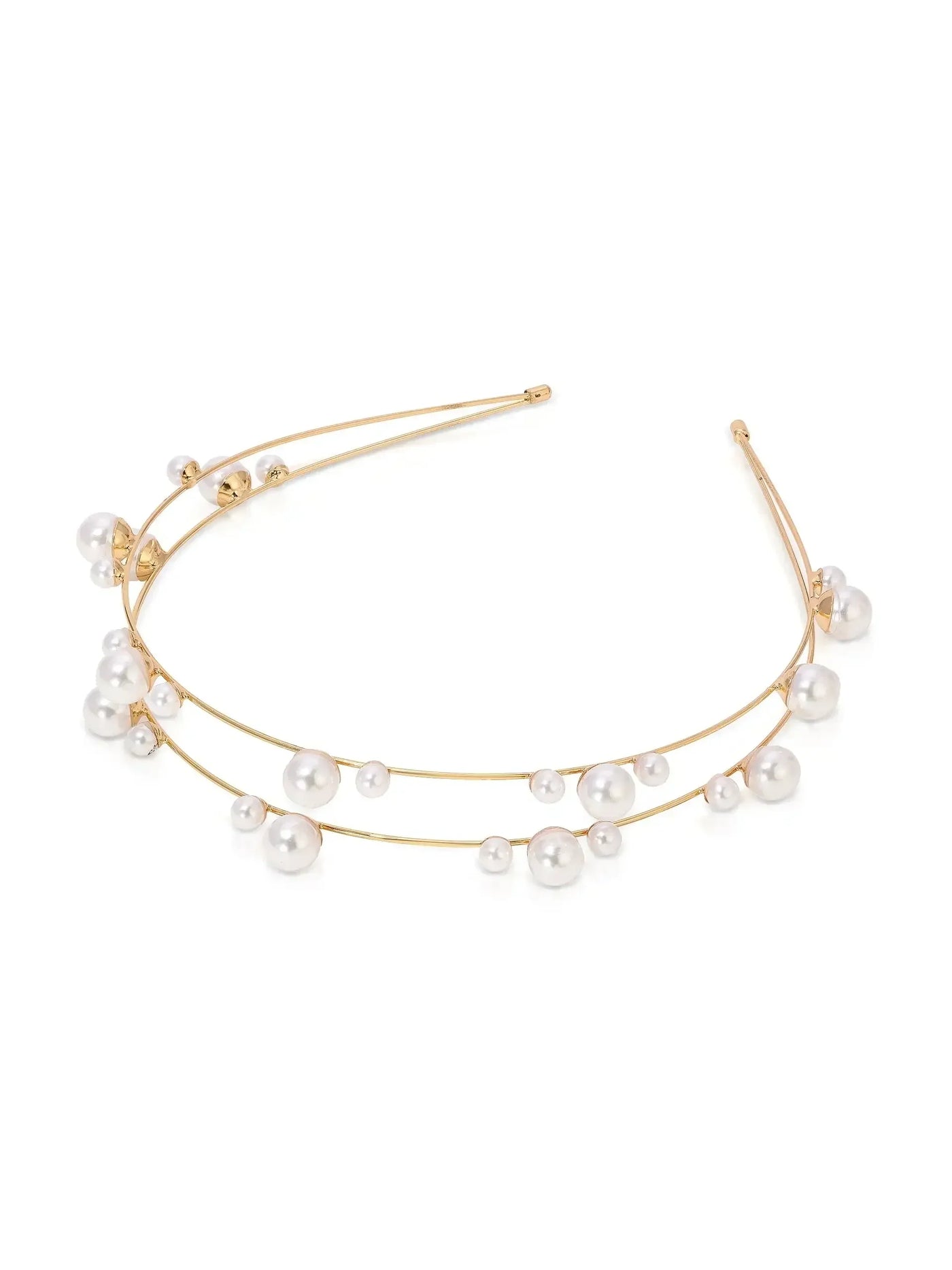 A delicate gold headband features multiple pearls arranged along two curved wires. The accessory is designed for elegant occasions, set against a plain white background.