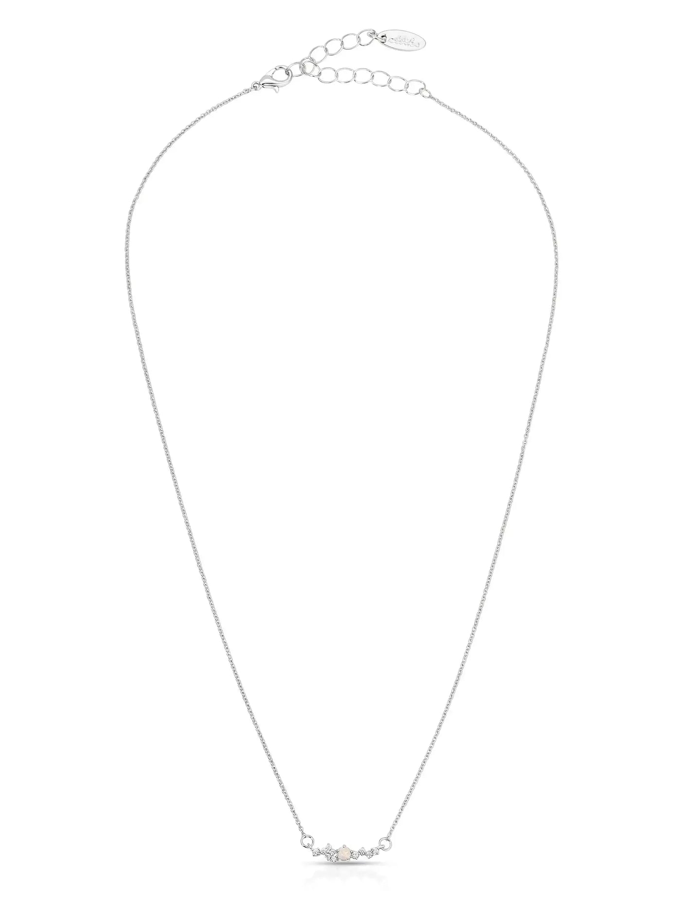 A delicate silver necklace features a central decorative element with three gemstones, set against a simple white background. It is designed to be elegant and understated.