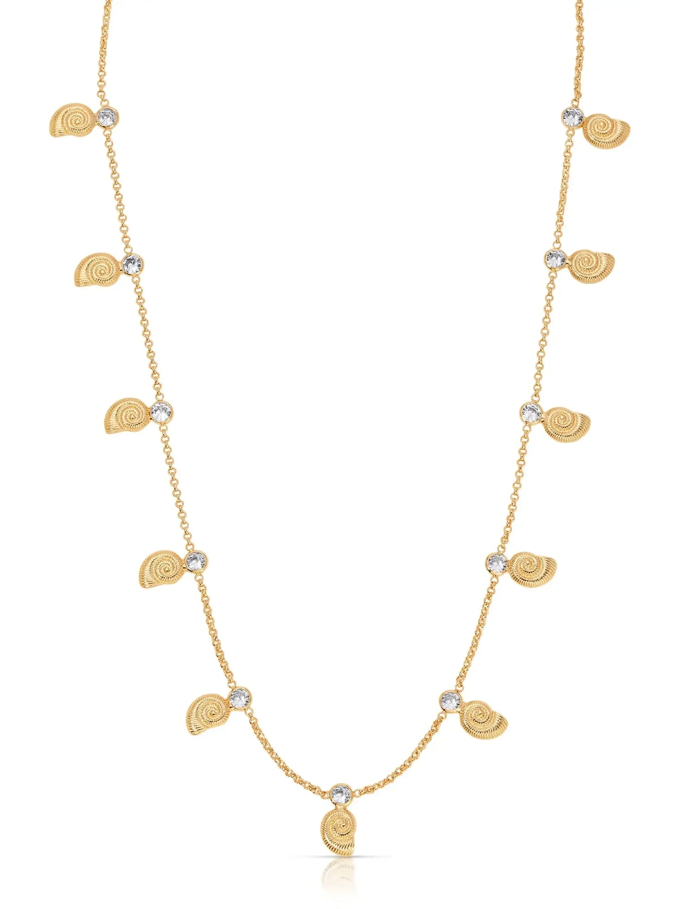 A gold necklace features small spiral shell pendants alternating with round, sparkling stones, elegantly hanging in a delicate chain, showcasing a fashionable beach-inspired design.