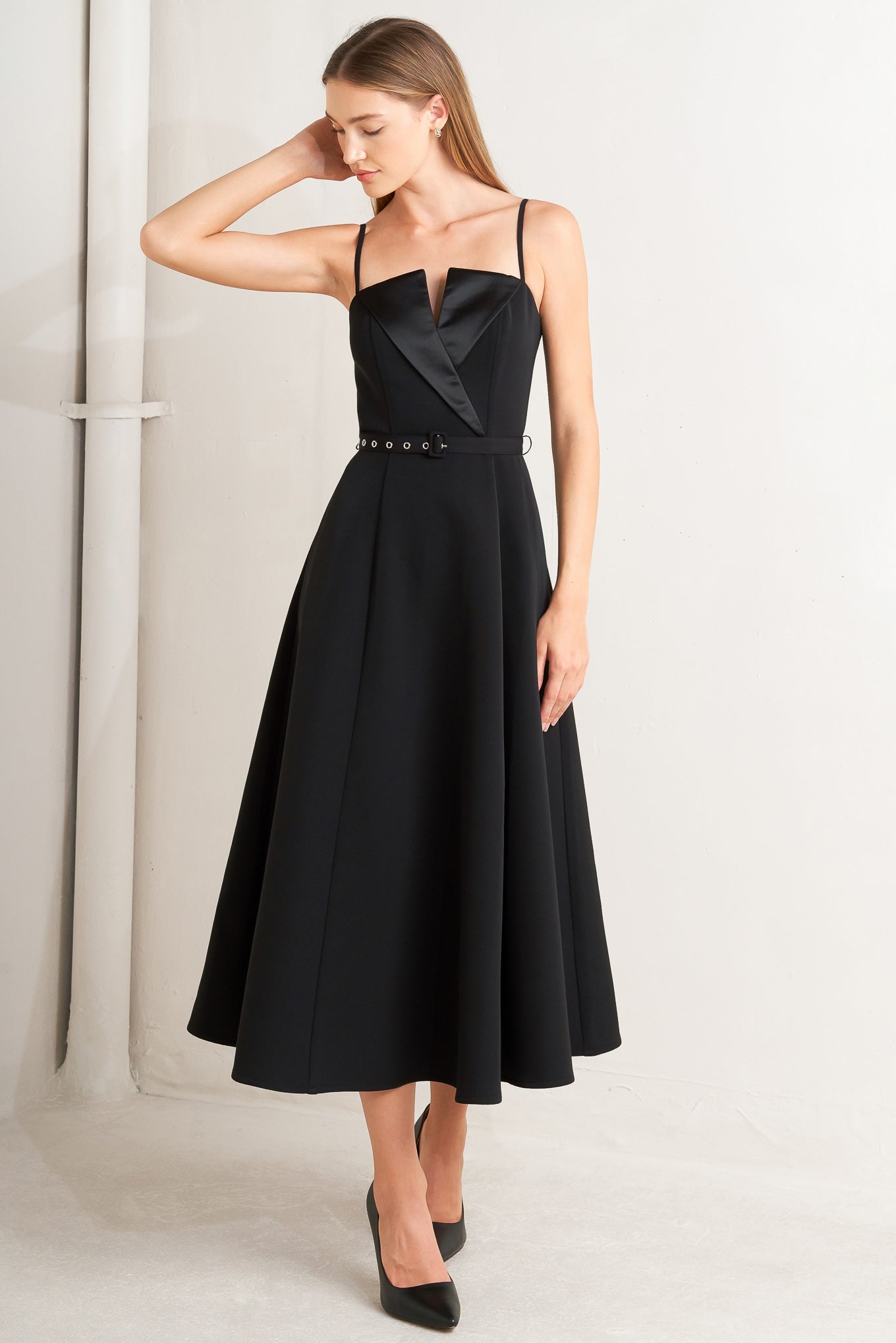 Black dress with a fitted bodice and flared skirt