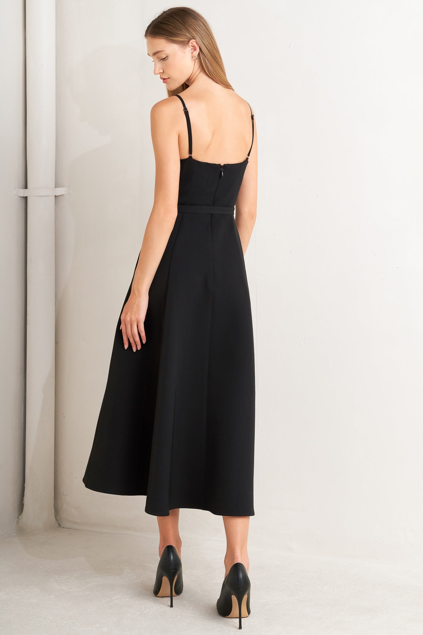 Black dress with a fitted bodice and flared skirt