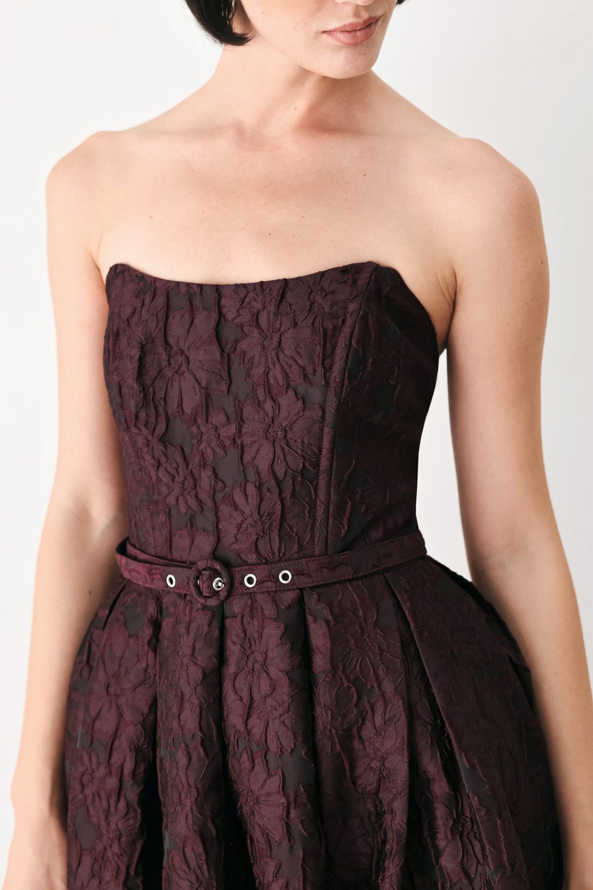 Burgundy Strapless Jacquard Midi Dress with Pockets in Burgundy, close-up of corset bodice and belt | Lady Black Tie