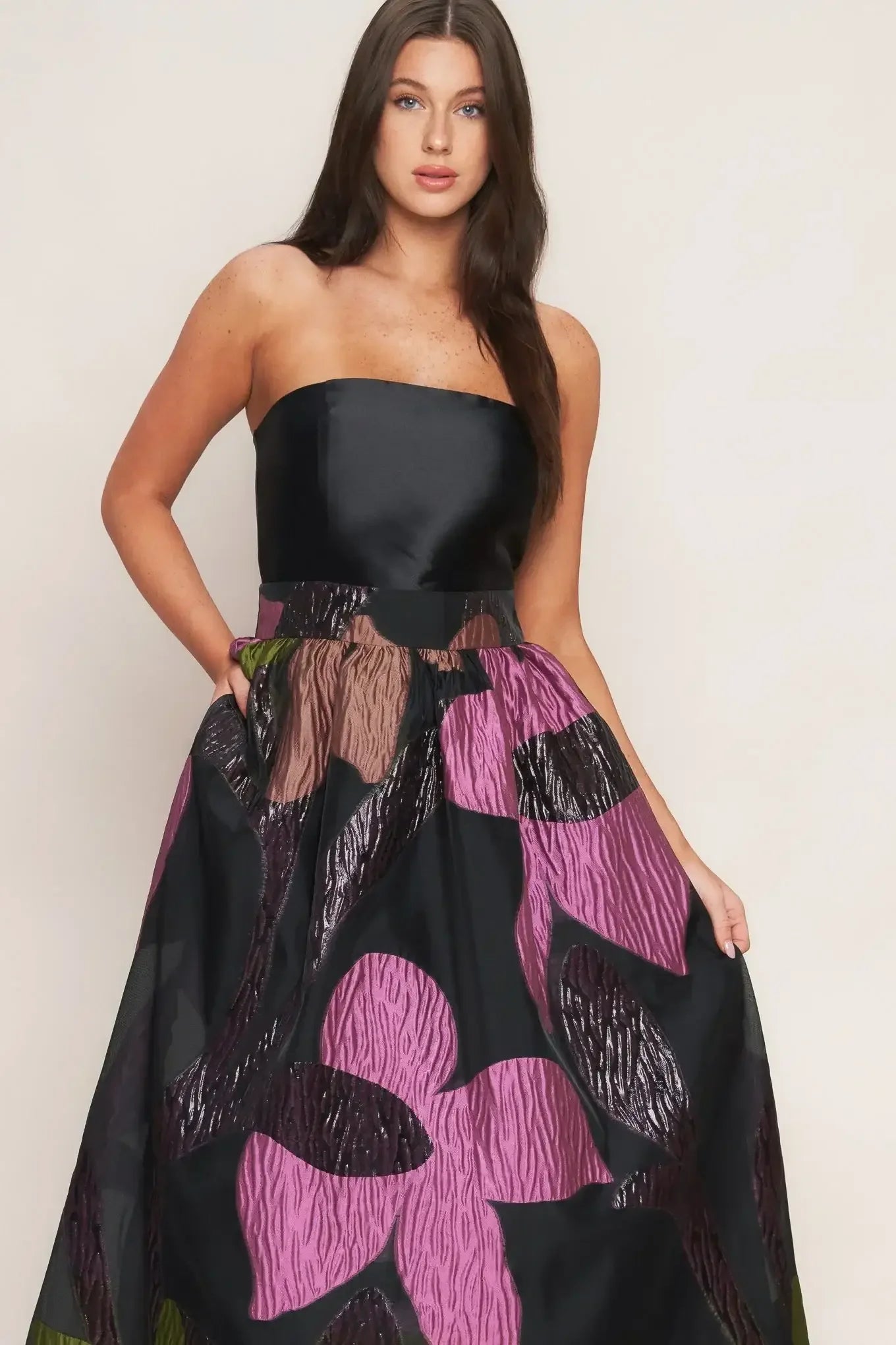 Strapless black dress with a colorful floral pattern