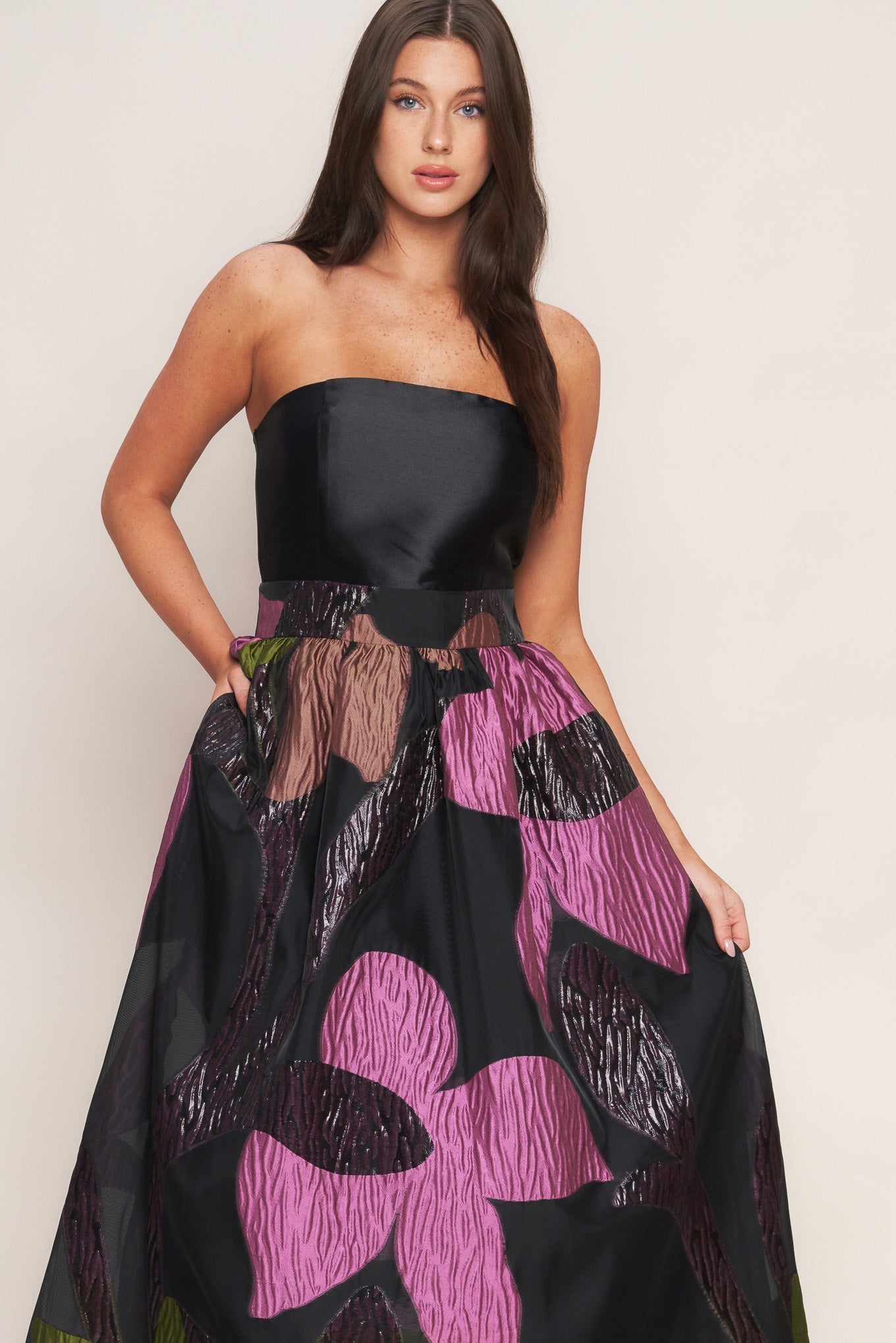 Strapless black dress with a colorful floral pattern