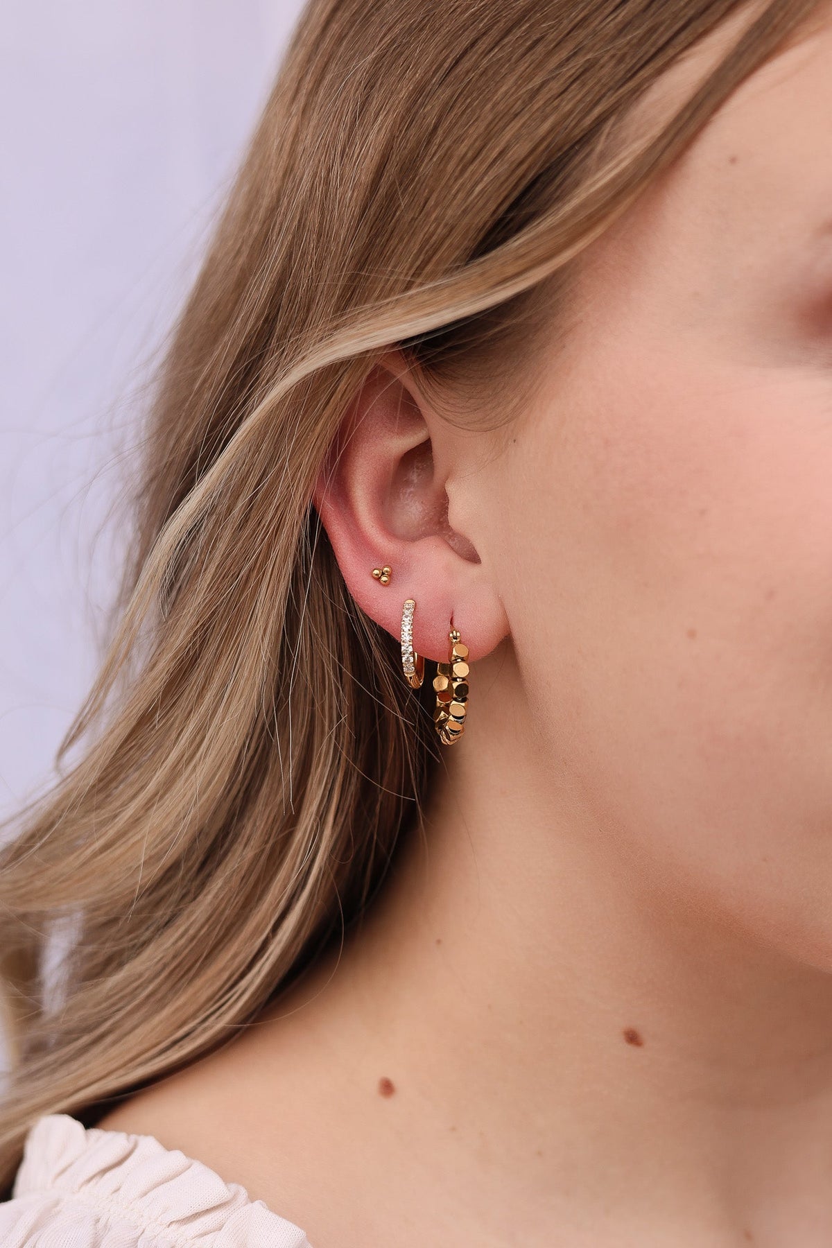 Beaded Spinner Hoop Earrings in Gold, worn on model | Lady Black Tie