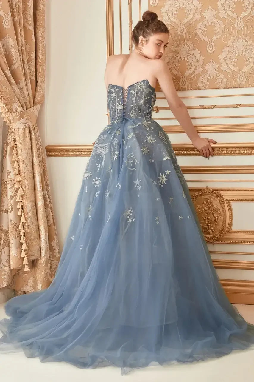 A woman in a shimmering blue gown adorned with silver star patterns leans against an ornate wall, surrounded by luxurious drapes, evoking an elegant, dreamy atmosphere.