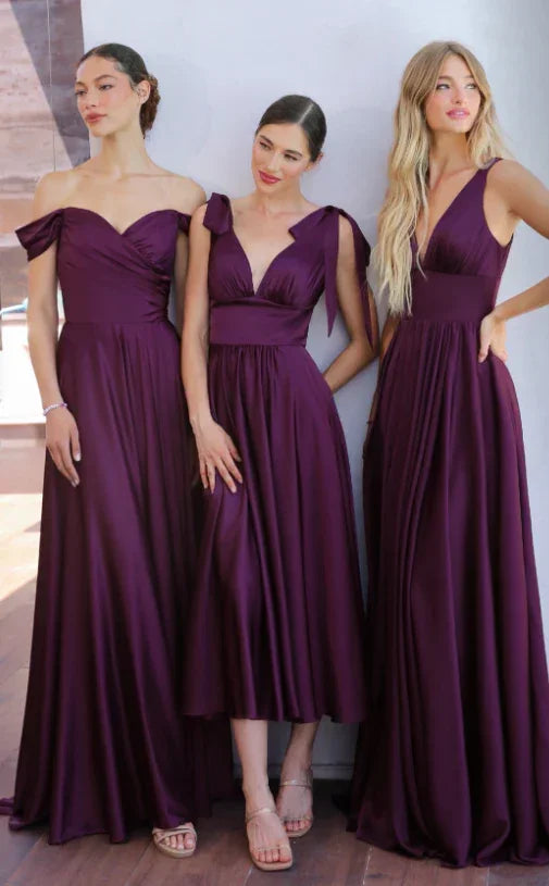 3 Ladies Wearing Eggplant Bridesmaid Dresses
