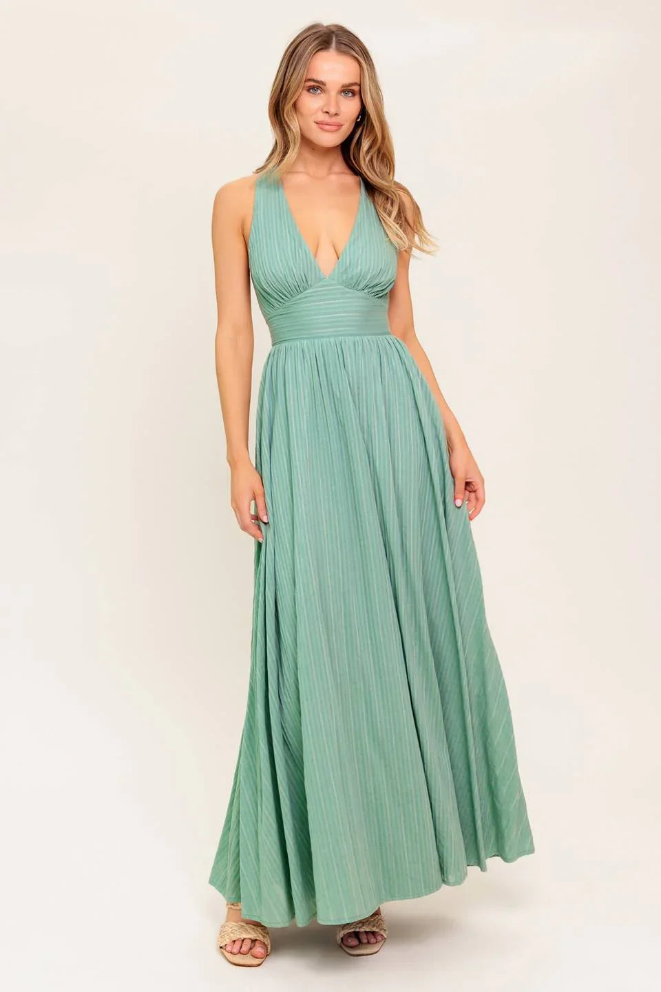Model in green maxi dress