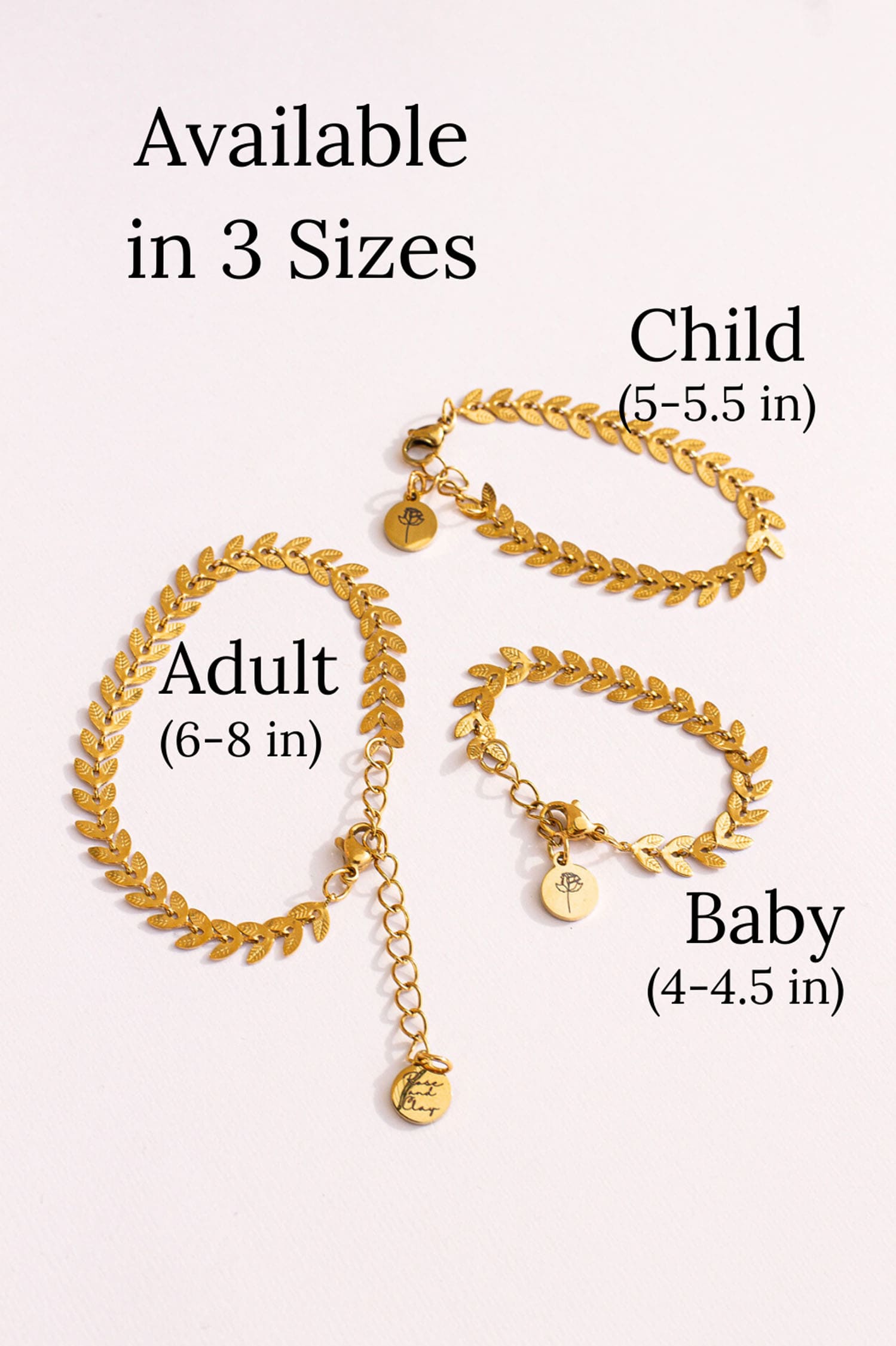Gold necklaces of different sizes on a white background