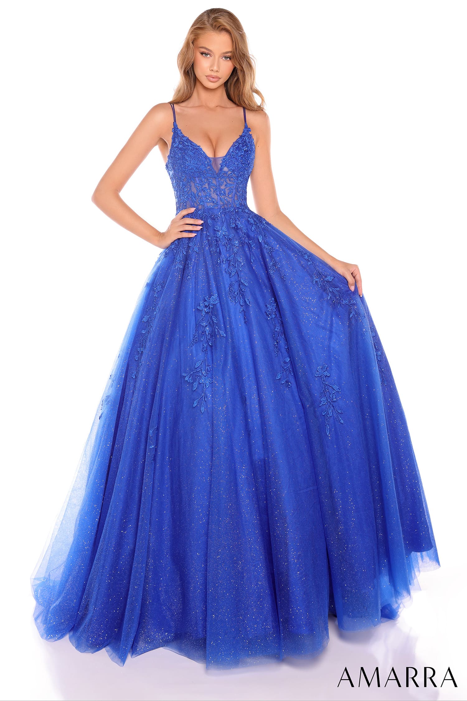 Blue evening gown with intricate detailing on a white background, brand 'AMARRA' visible.