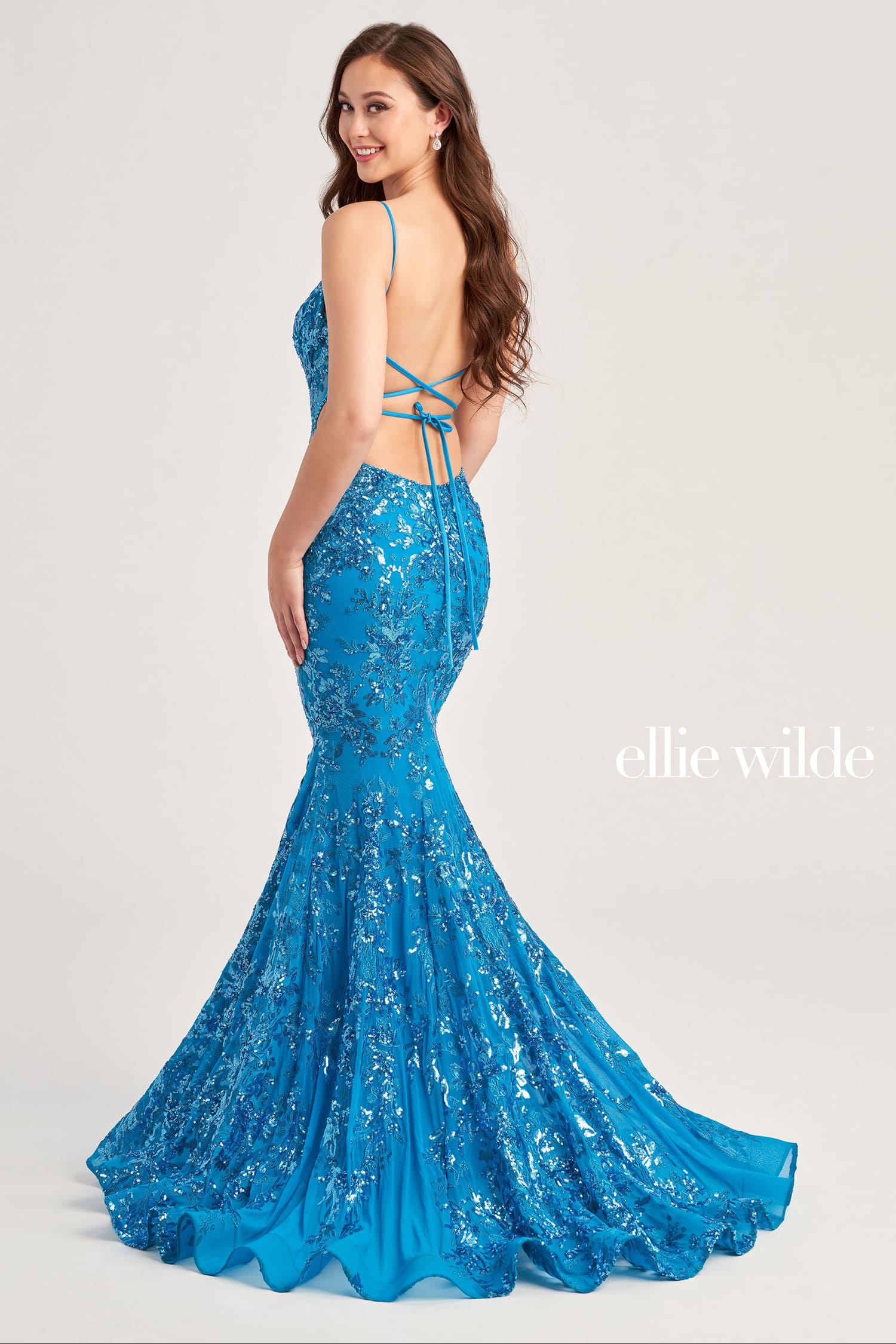 Blue sequin dress with open back on a white background, featuring the brand 'ellie wilde'.