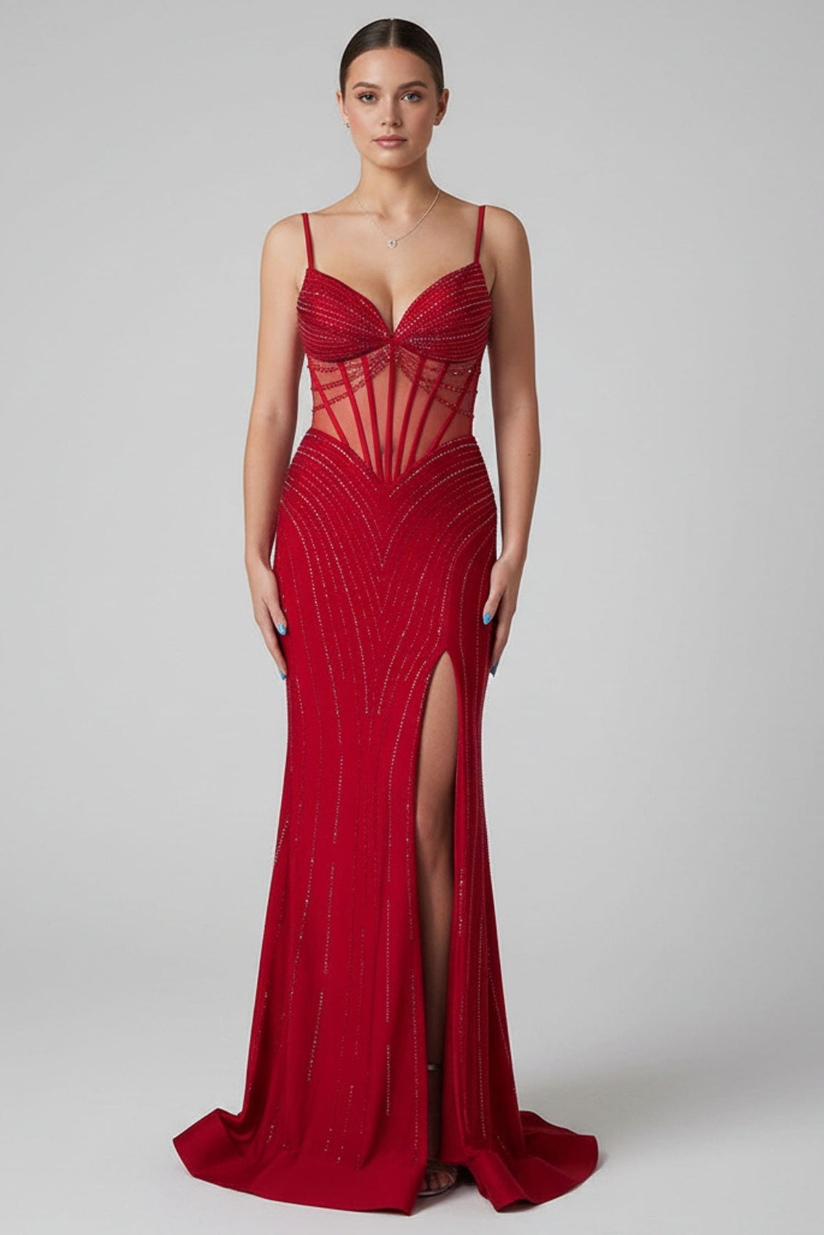 Red evening gown with a high slit on a gray background