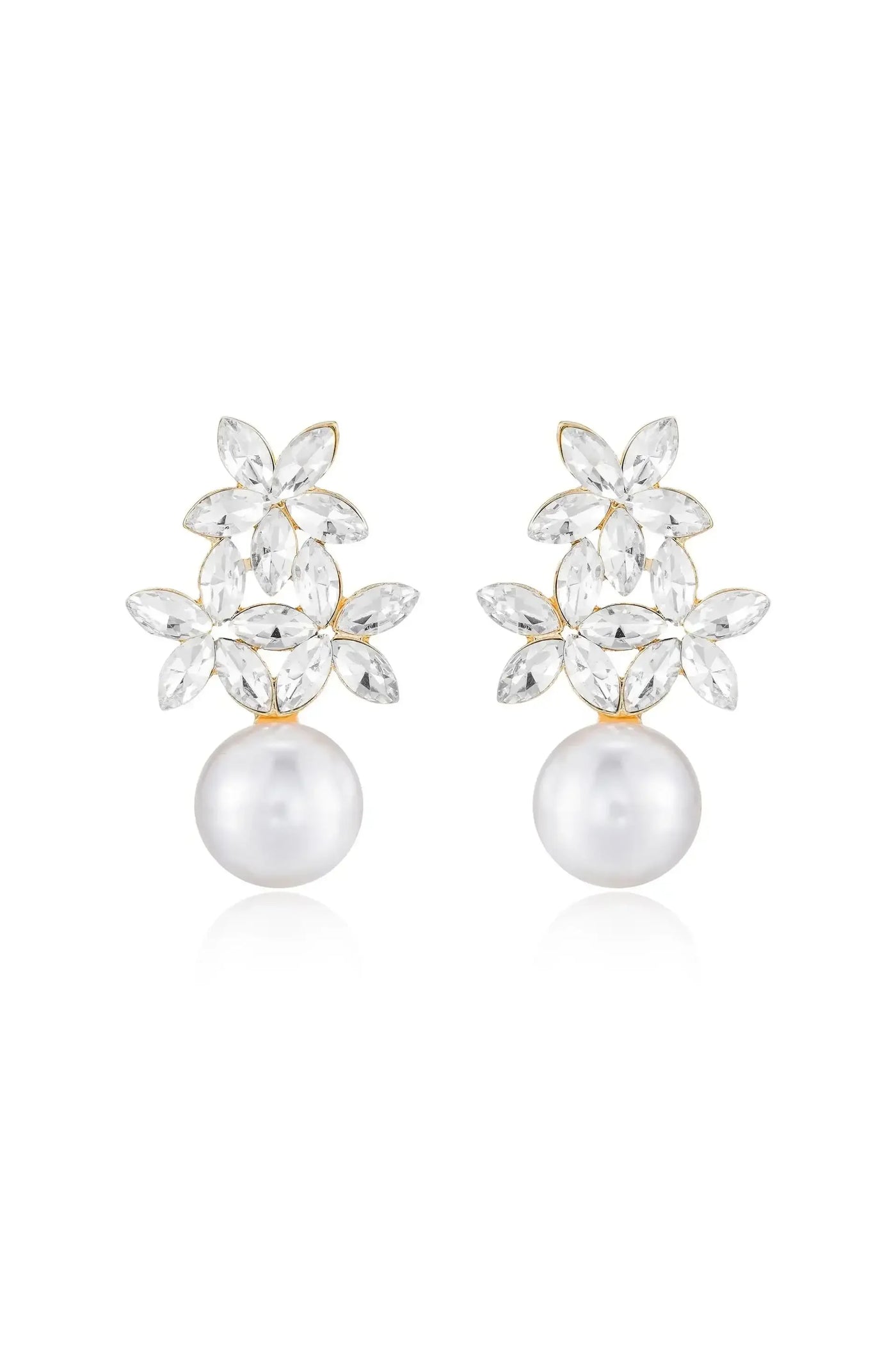 A pair of elegant earrings features clear, marquise-cut stones arranged like petals above a lustrous white pearl. The jewelry is set against a plain white background, emphasizing its beauty.
