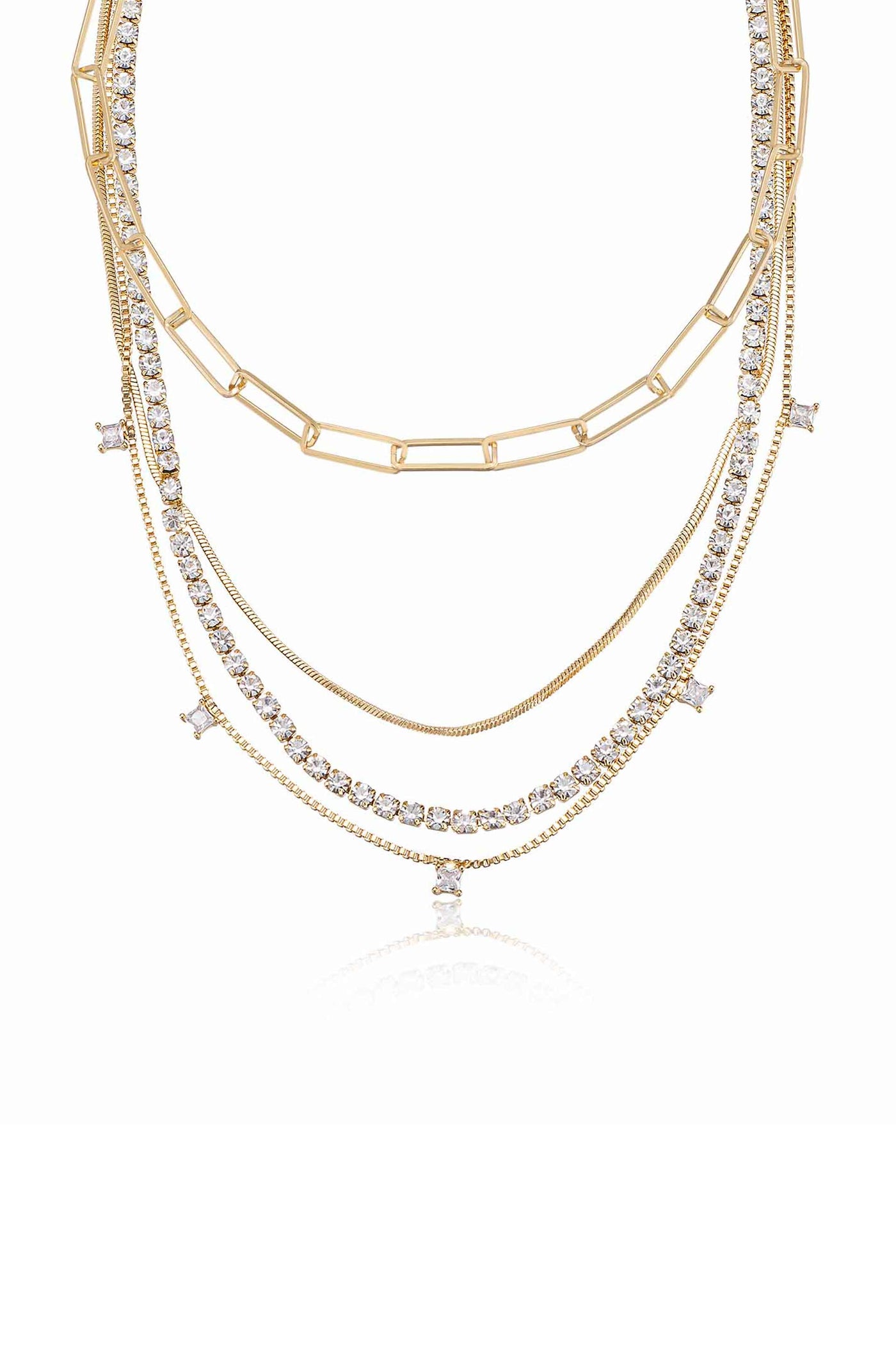 A layered gold-tone necklace features multiple strands, including sparkling rhinestones and delicate chains, creating an elegant accessory against a clean, white background.
