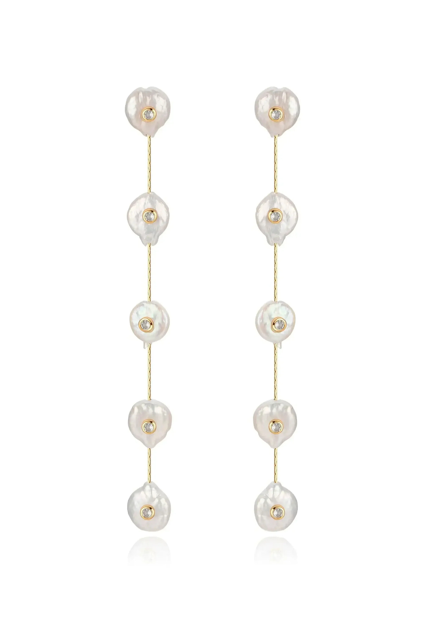 Two long earrings feature irregularly shaped, lustrous pearls spaced along a delicate gold chain, each adorned with a small gemstone, providing an elegant and sophisticated look.