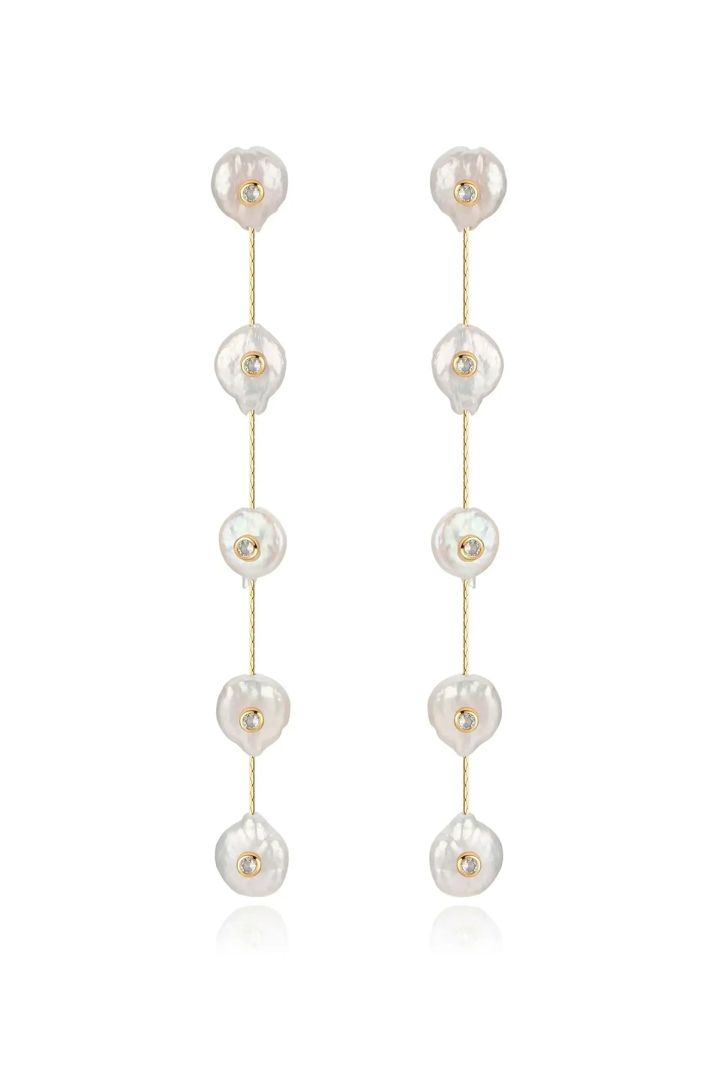 Two long earrings feature irregularly shaped, lustrous pearls spaced along a delicate gold chain, each adorned with a small gemstone, providing an elegant and sophisticated look.