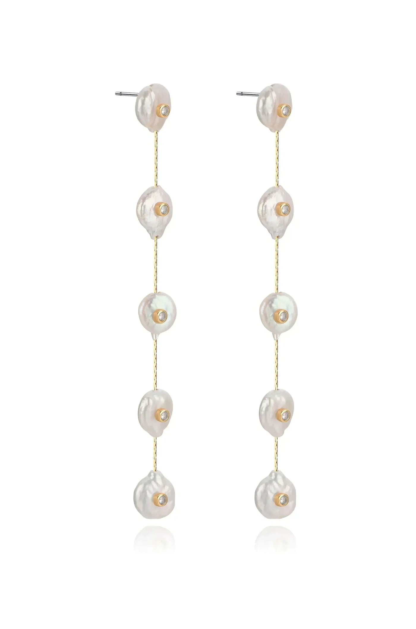 Dangling earrings feature multiple irregularly shaped pearls attached to a thin gold chain, reflecting soft light against a simple white background, emphasizing their elegance and craftsmanship.