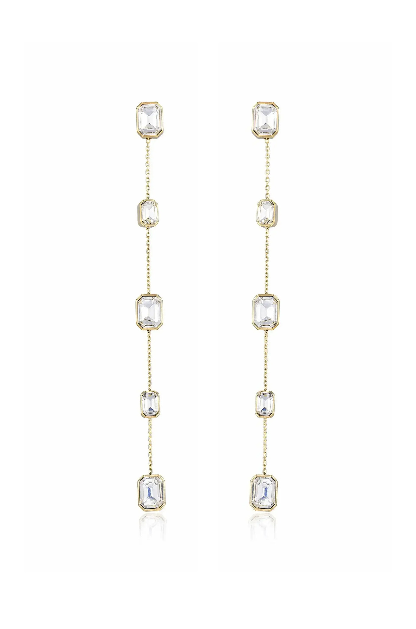 Gold dangle earrings feature multiple clear octagonal crystals linked by delicate chains, showcasing elegance and shine. They stand against a neutral background, highlighting their refined design and sparkle.