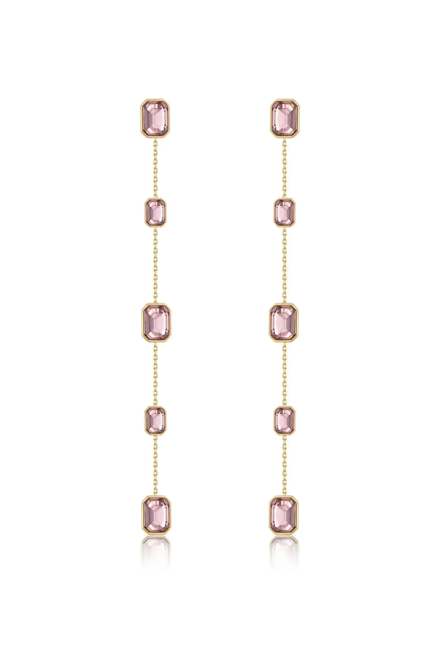 Delicate dangling earrings feature multiple pink gemstones set in gold. The arrangement showcases vertical chains, reflecting light and adding elegance in a neutral backdrop.