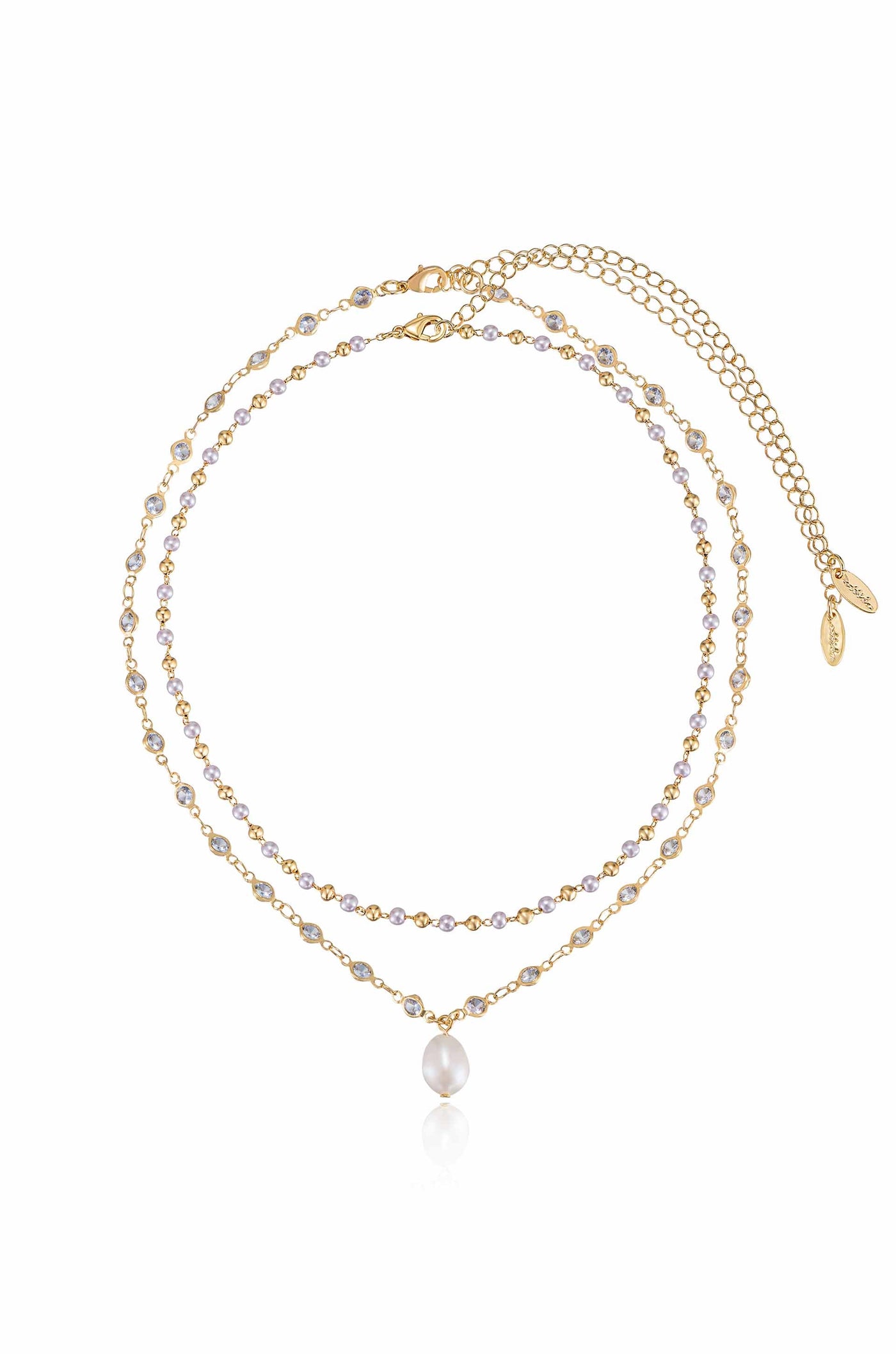 A layered gold necklace adorned with alternating purple and clear beads. It features a central pearl drop, resting on a reflective surface, showcasing elegance against a plain background.