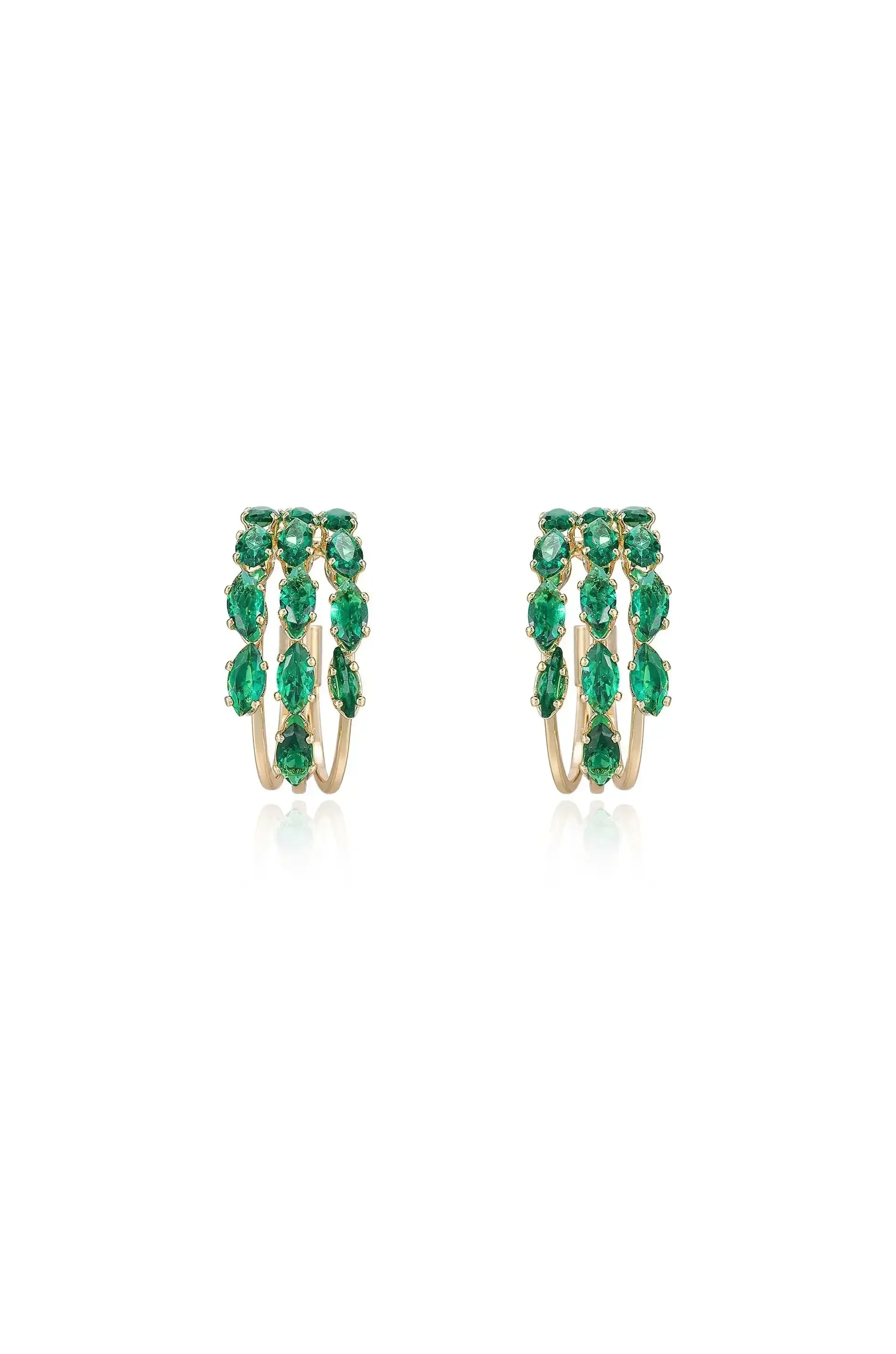 Two elegant gold hoop earrings are adorned with vibrant green gemstones. They are displayed symmetrically against a clean, white background, emphasizing their luxurious design and sparkling details.