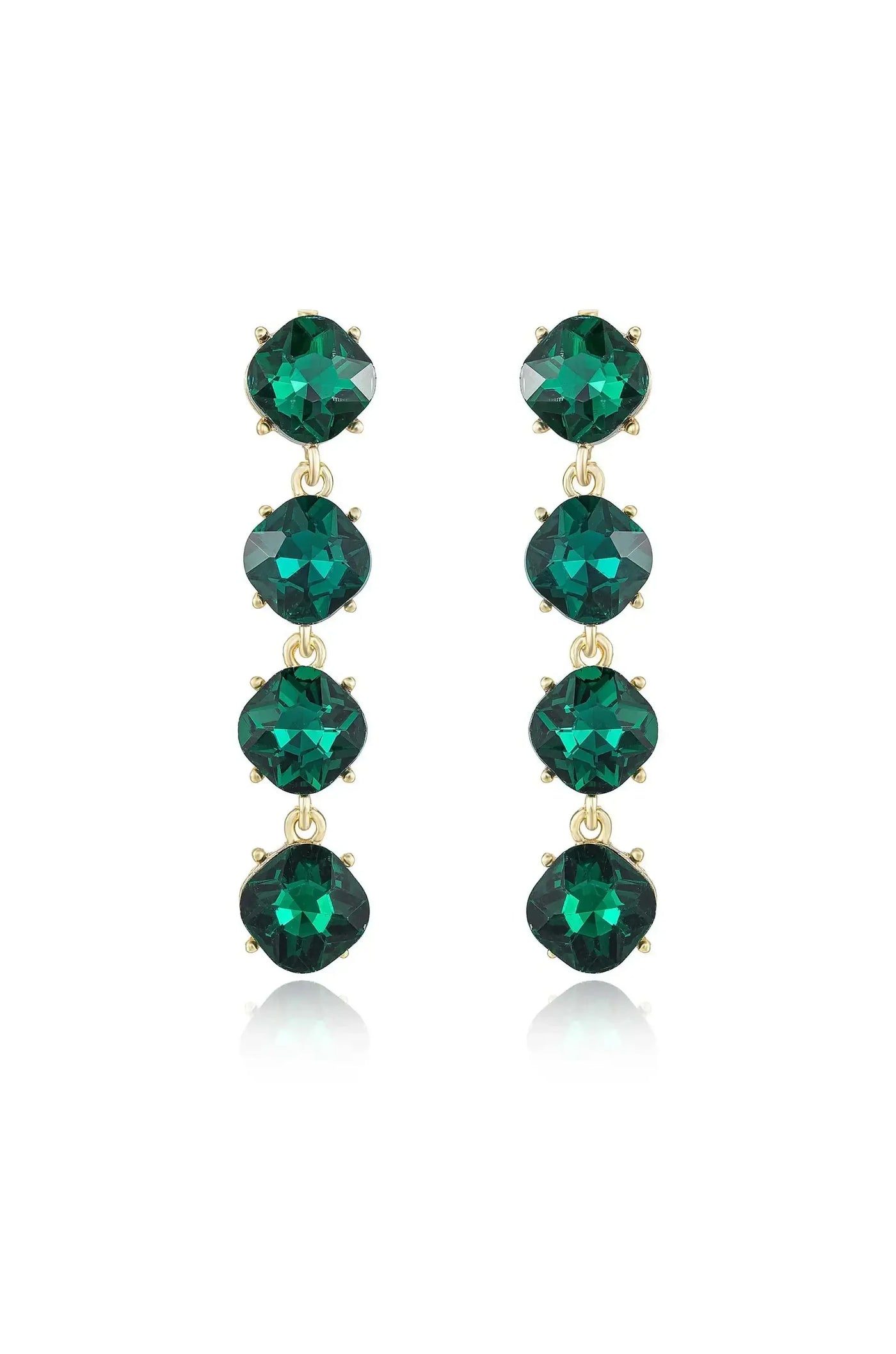Long, elegant earrings feature five green gemstones, each encased in gold metal settings. They hang vertically, reflecting light, against a plain white background, emphasizing their color and sparkle.