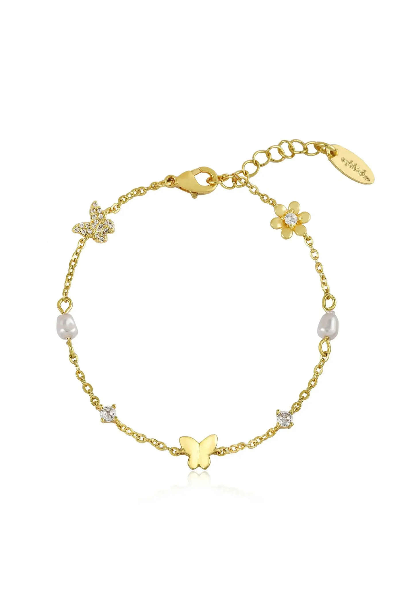 A delicate gold bracelet features intricate butterfly and flower charms, with sparkling crystals and pearls. It is showcased against a clean, white background, emphasizing its elegance and detail.