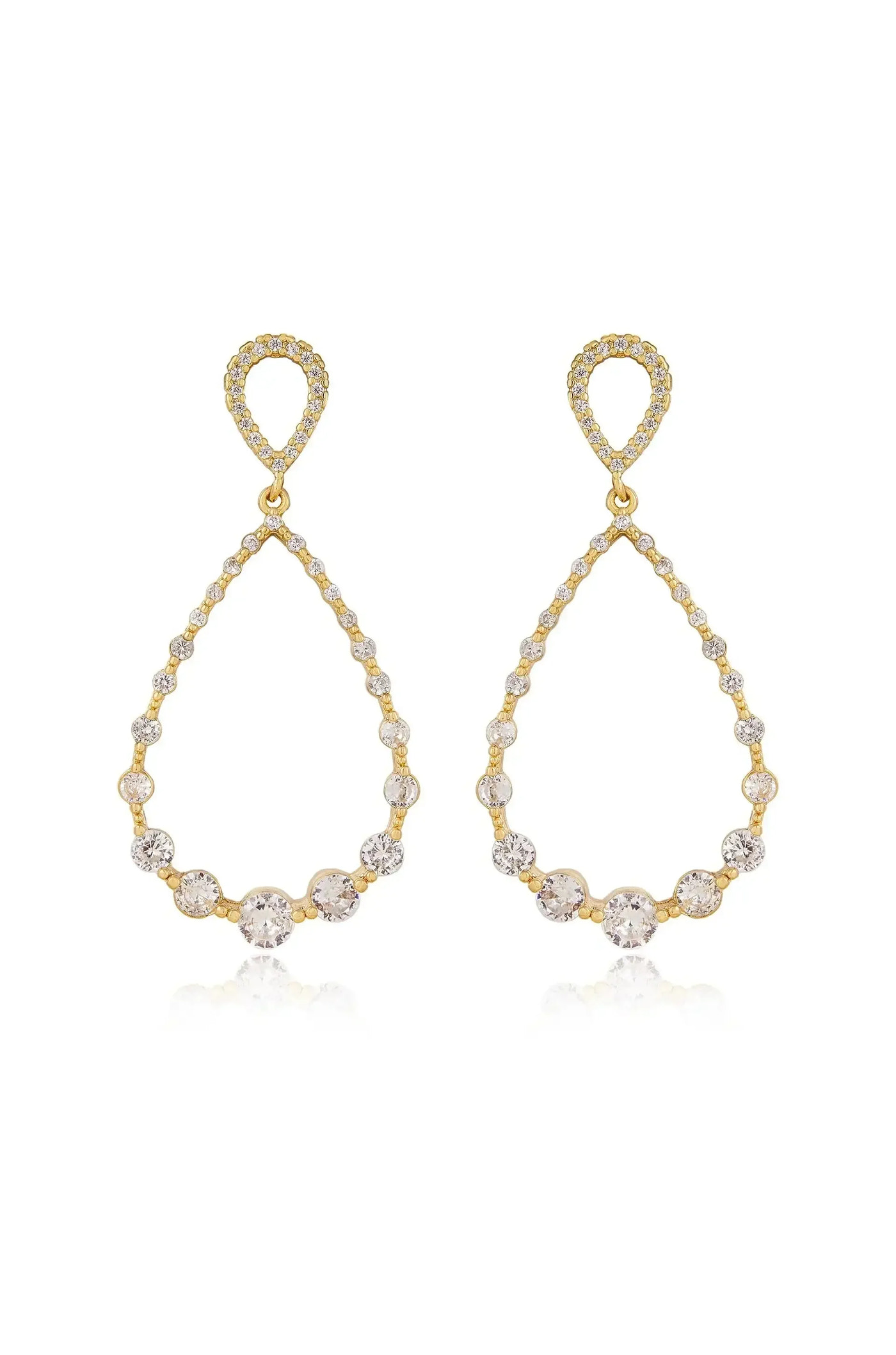 Two elegant gold teardrop earrings are displayed, featuring sparkling stones along their curved edges. They are positioned to reflect light, enhancing their shine against a plain background.