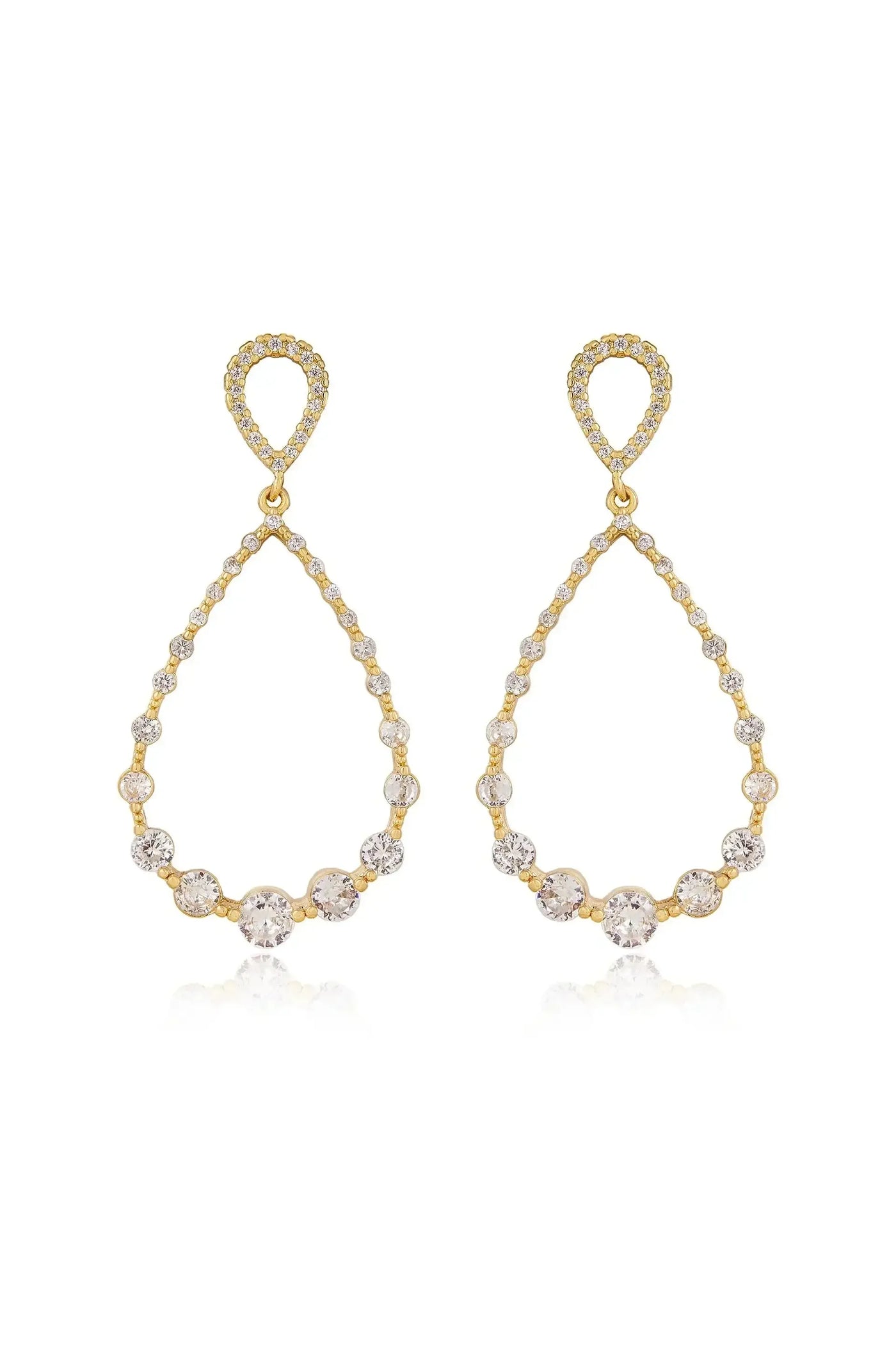 Two elegant gold teardrop earrings are displayed, featuring sparkling stones along their curved edges. They are positioned to reflect light, enhancing their shine against a plain background.