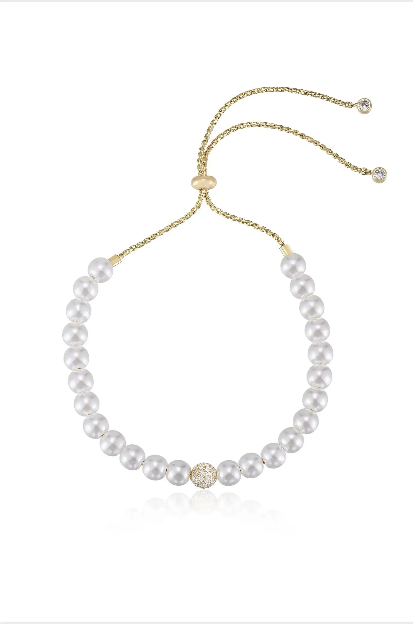 A pearl necklace features evenly spaced white pearls, with a decorative gold and crystal clasp at the center. The background is plain, emphasizing the necklaceâ€™s elegance and design.