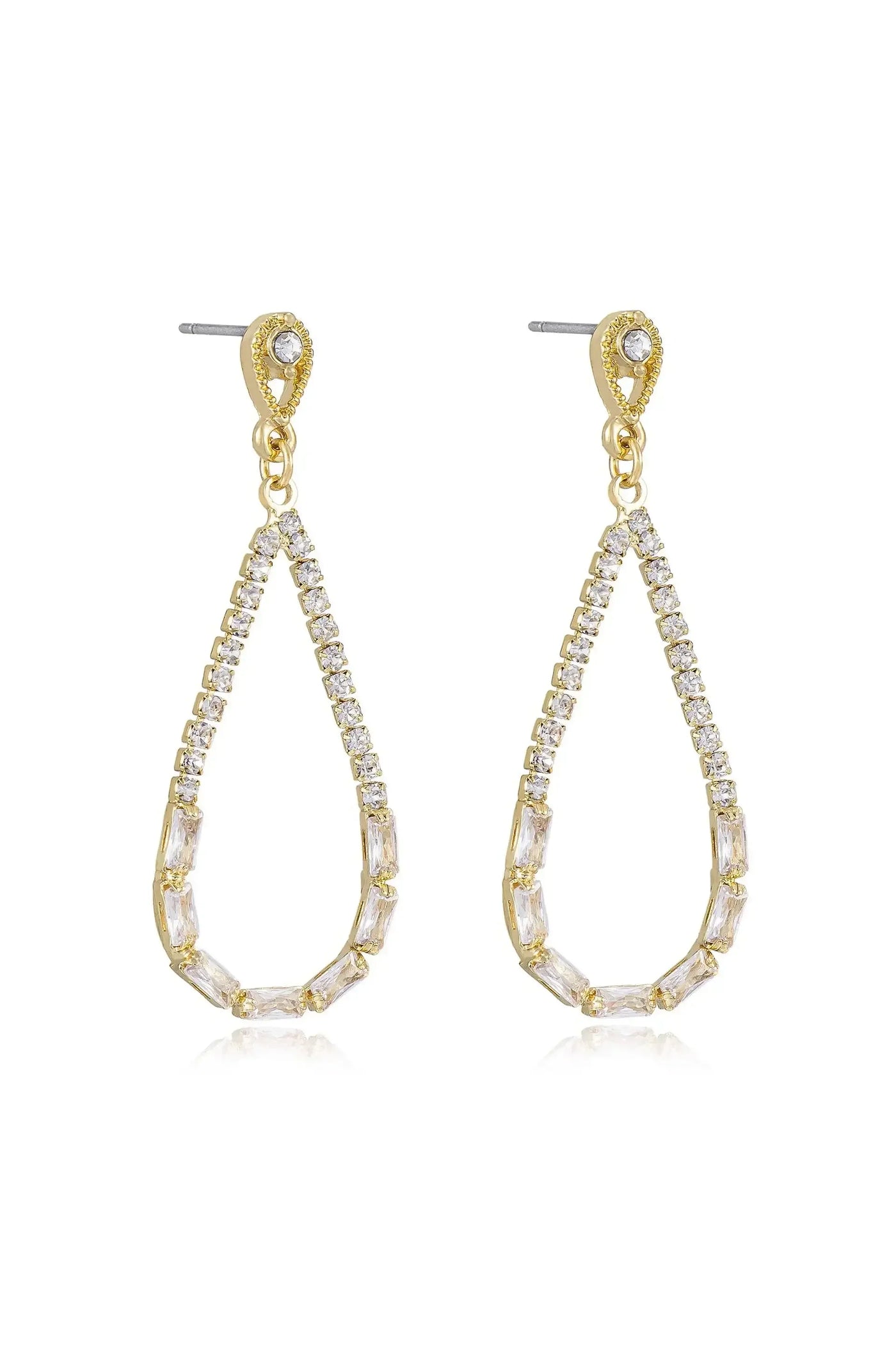 Gold teardrop earrings adorned with sparkling clear crystals hang gracefully. The earrings exhibit a modern design, reflecting light, suitable for formal or elegant occasions.