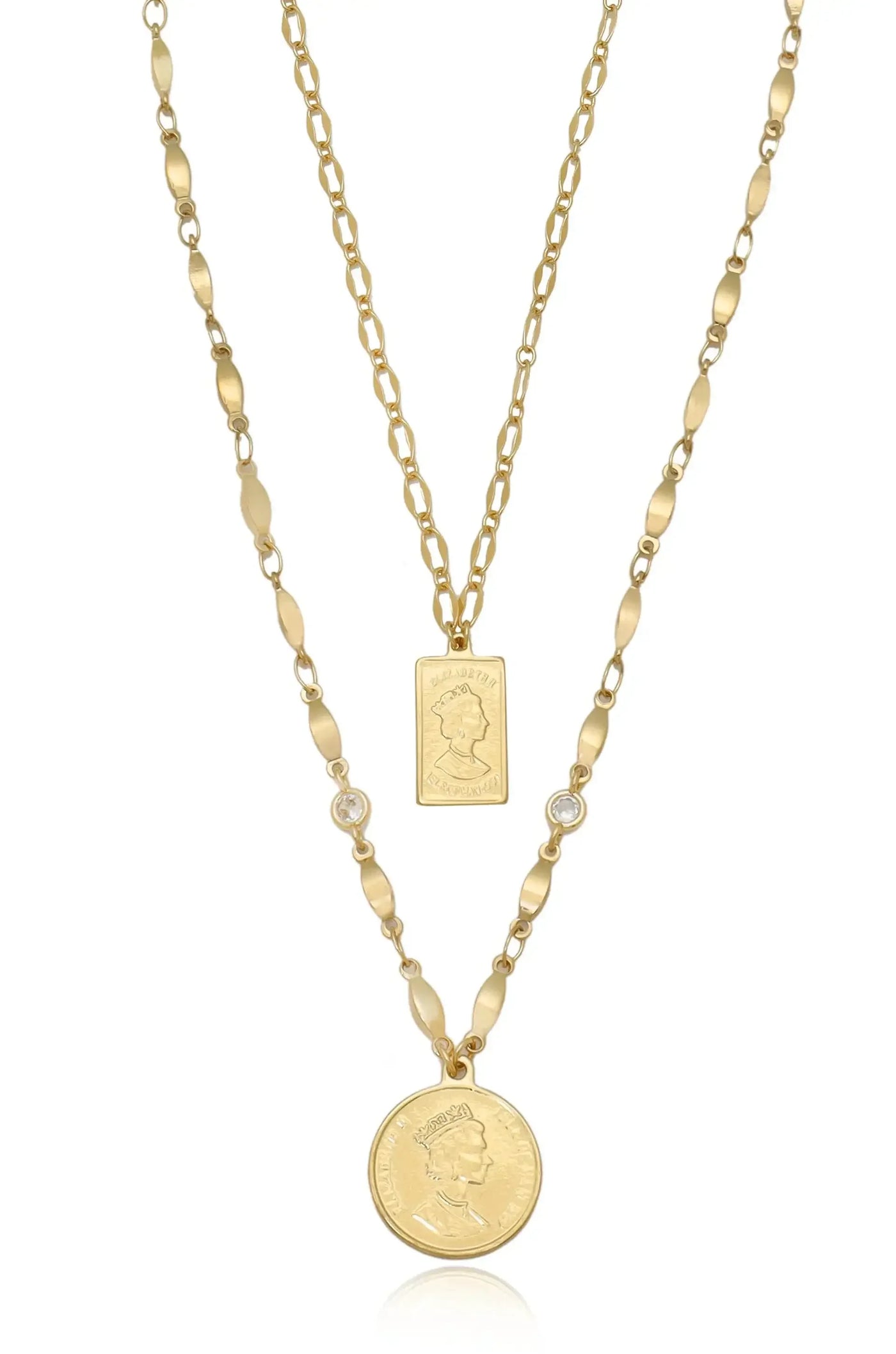 A gold layered necklace features two chains. One displays a rectangular pendant with an engraved portrait, while the other has a round coin pendant, all set against a white background.