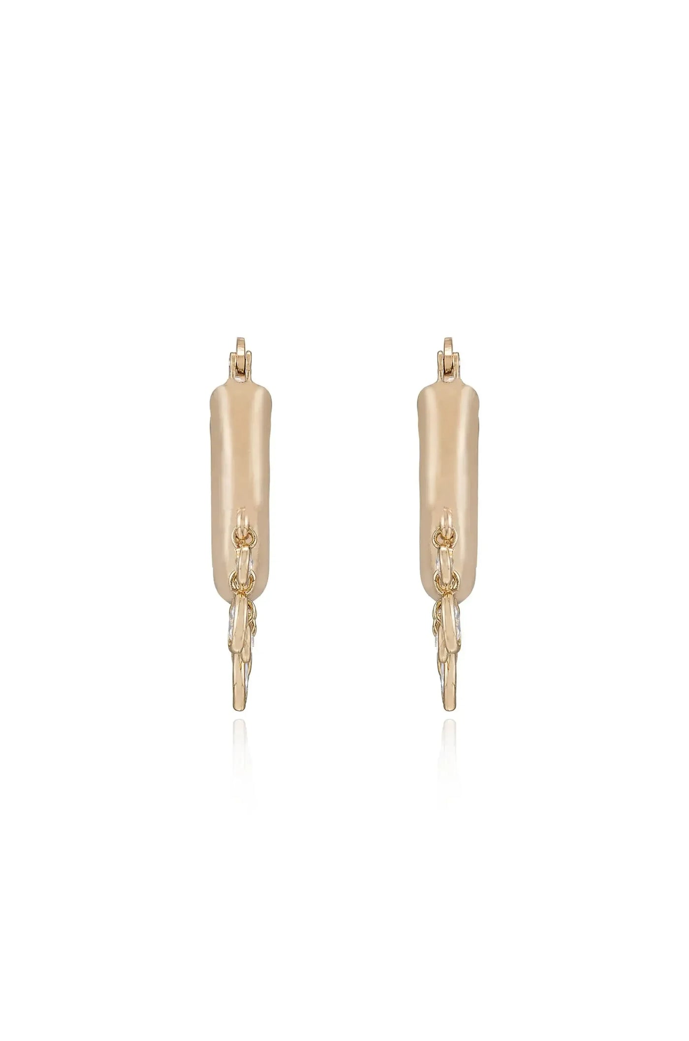 Stylish gold earrings hang vertically, showcasing a sleek design with a decorative chain element. They appear to reflect light against a simple, neutral background, emphasizing their elegant form.