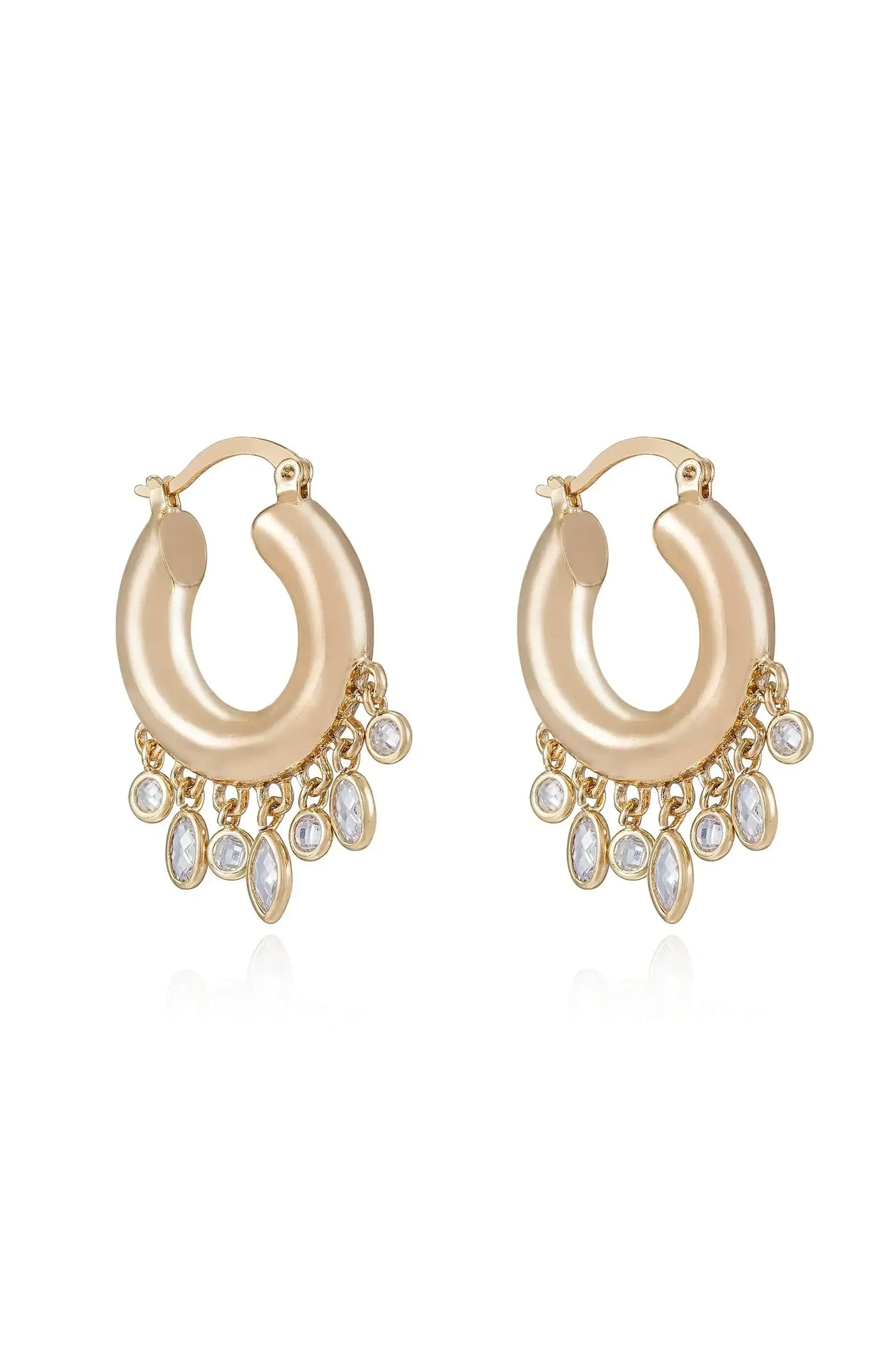 Gold hoop earrings feature a smooth, round shape with dangling, sparkling gemstones at the bottom, reflecting light against a simple background, emphasizing their elegance and shimmer.