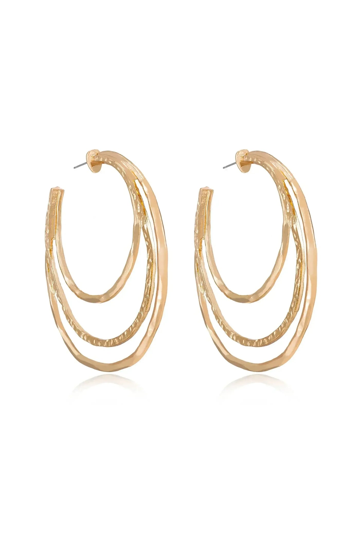 A pair of gold hoop earrings featuring three layered, curved designs. They are displayed against a reflective surface, highlighting their shine and textured details.