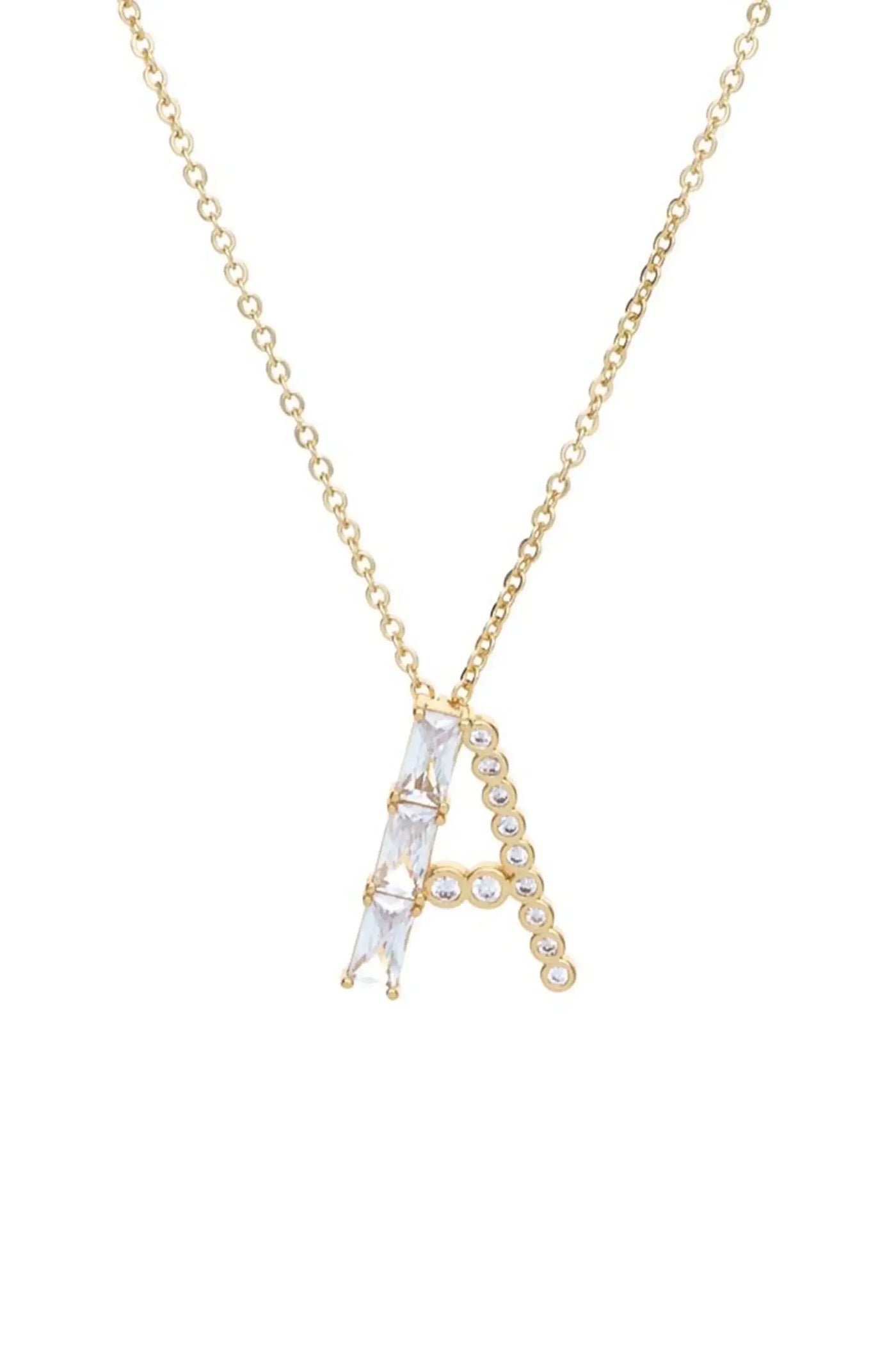 A gold necklace features a prominent letter "A" designed with clear gemstones. The necklace hangs against a plain white background, emphasizing its elegant design and sparkling details.