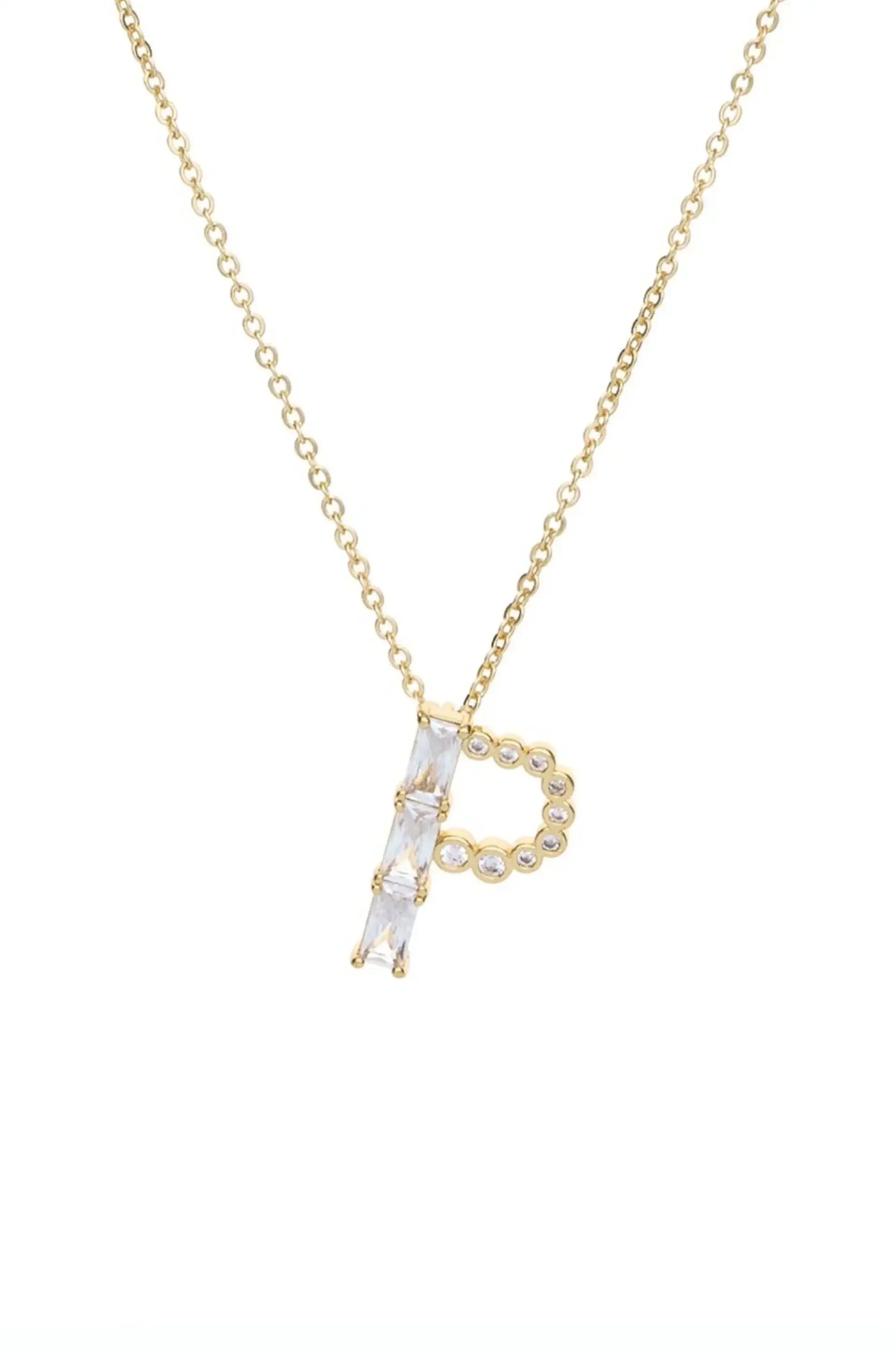 A gold necklace features a large letter "P" made of clear crystals, gracefully suspended from a delicate chain, placed against a simple white background.