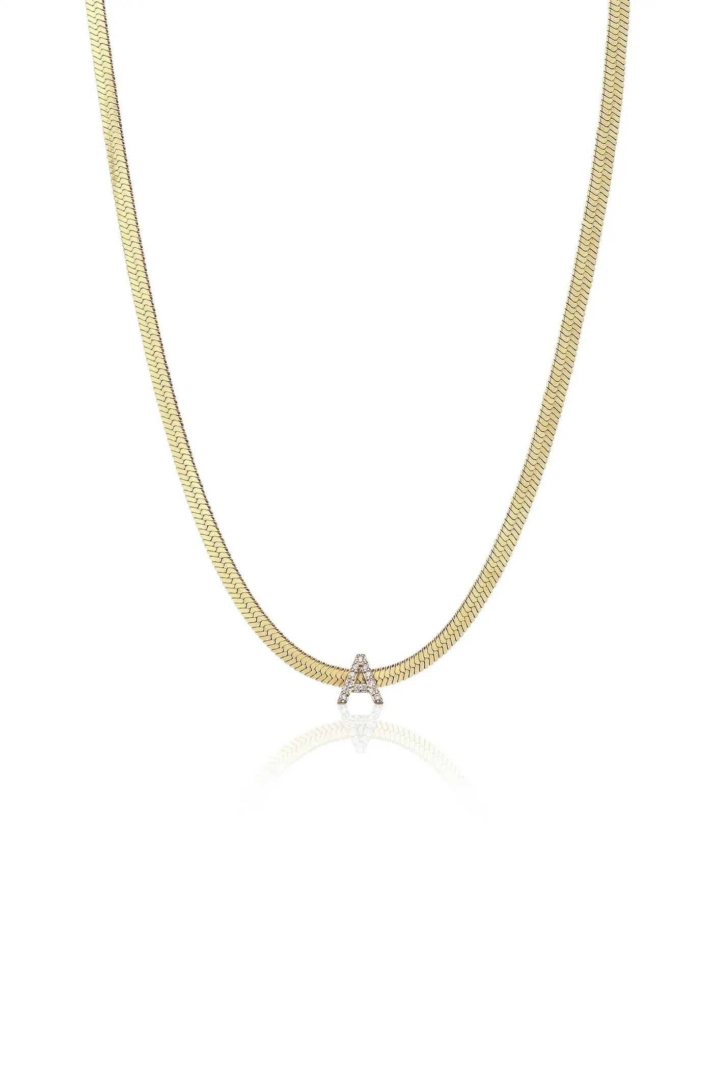 A gold chain necklace features a shimmering letter "A" embellished with diamonds, displayed against a plain white background that highlights its elegant design and reflective qualities.