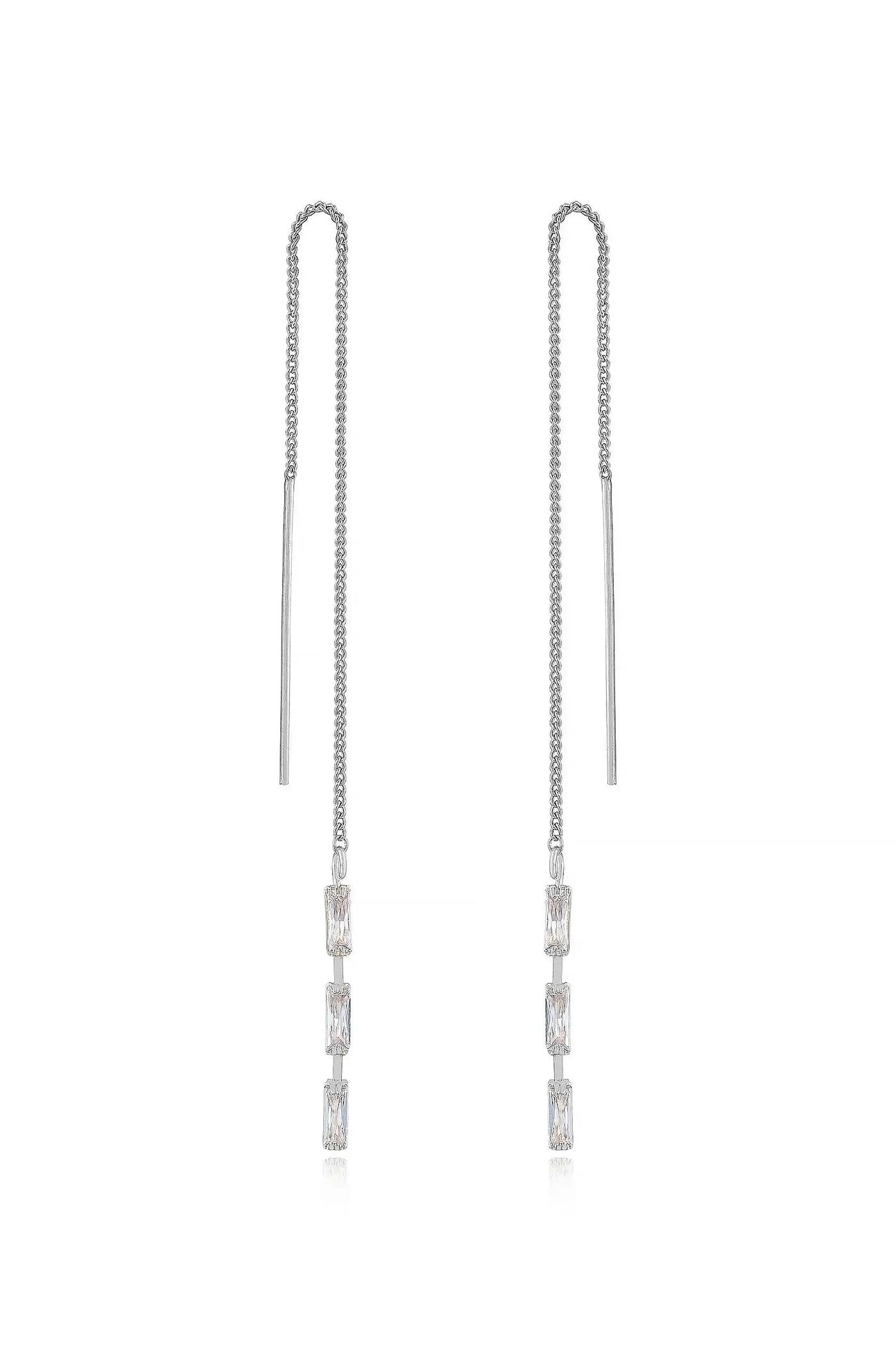 Two elegant silver chain earrings hang vertically, featuring rectangular gemstones that glisten. The background is minimalistic, enhancing the jewelry's shine and design.