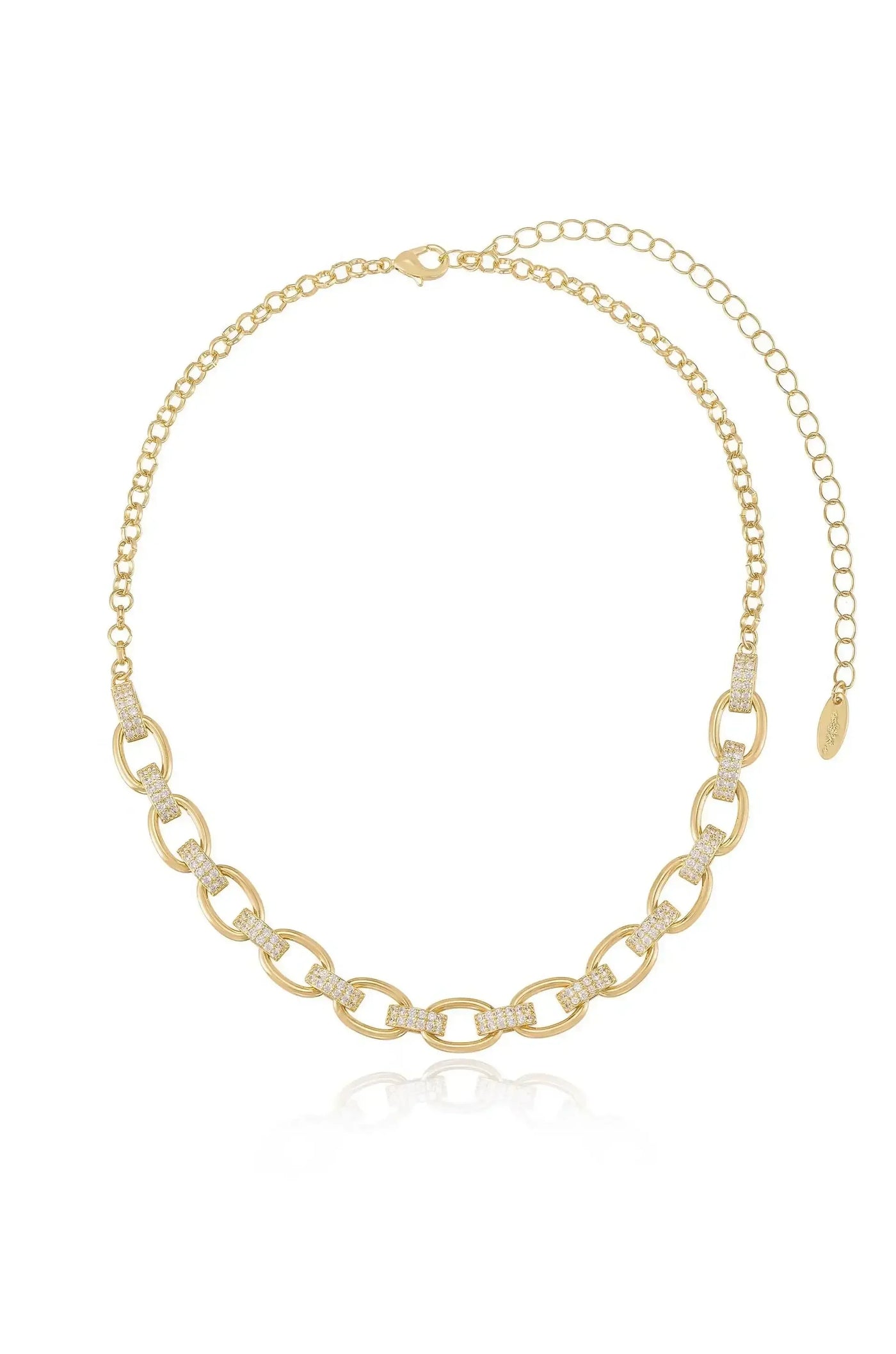 A gold chain necklace features alternating links and small gemstones. It is gracefully displayed against a white background, highlighting its elegance and reflective shine.