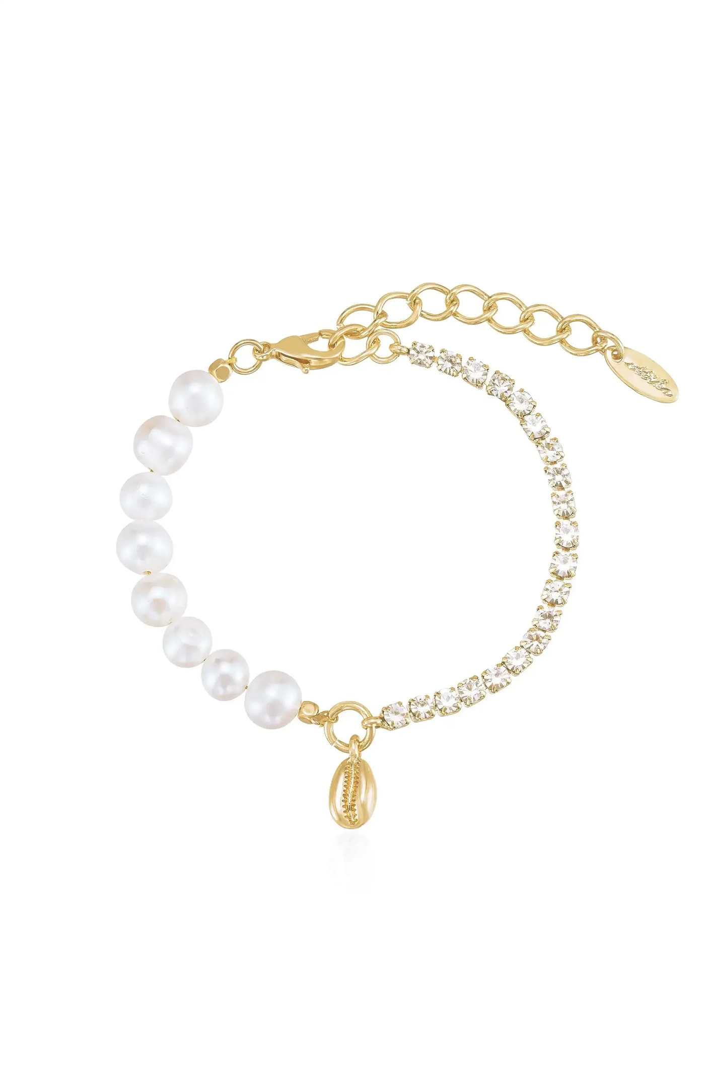 A delicate bracelet features alternating white pearls and sparkling crystals, connected with a gold chain. A small shell charm dangles from the clasp, adding an elegant touch.