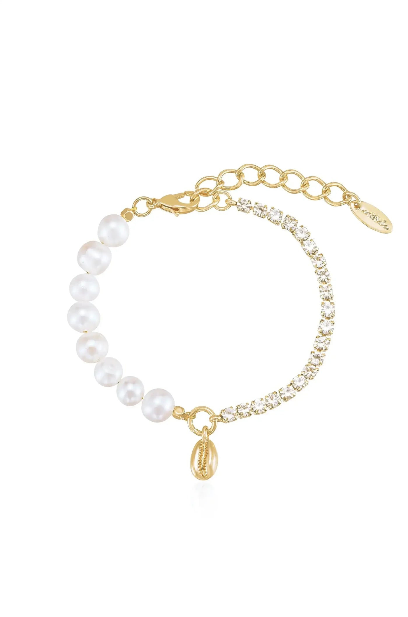 A delicate bracelet features alternating white pearls and sparkling crystals, connected with a gold chain. A small shell charm dangles from the clasp, adding an elegant touch.