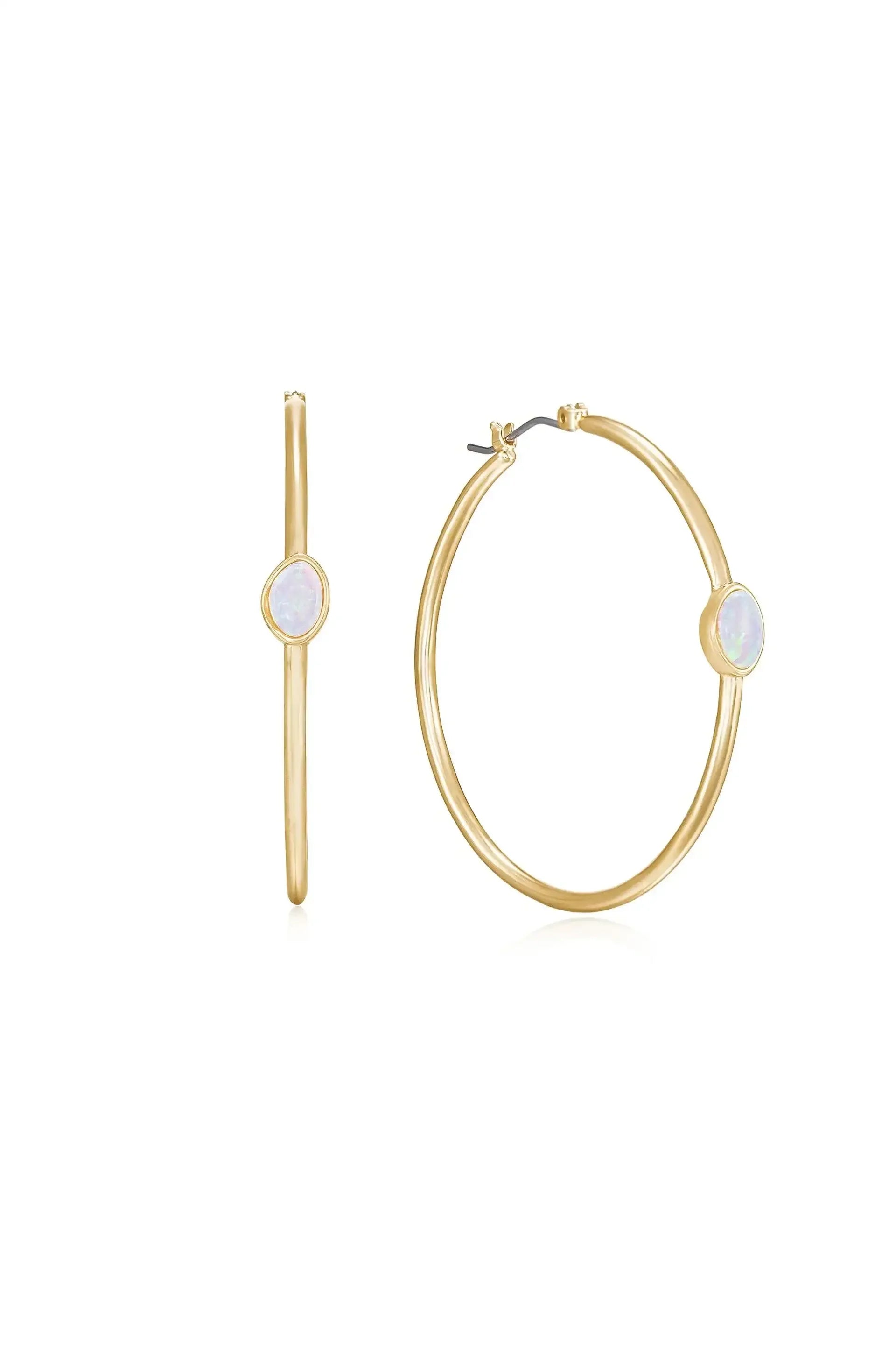 Gold hoop earrings featuring an opal stone at the center. The earrings are displayed against a plain white background, emphasizing their shine and design. One hoop is partially shown side-on.
