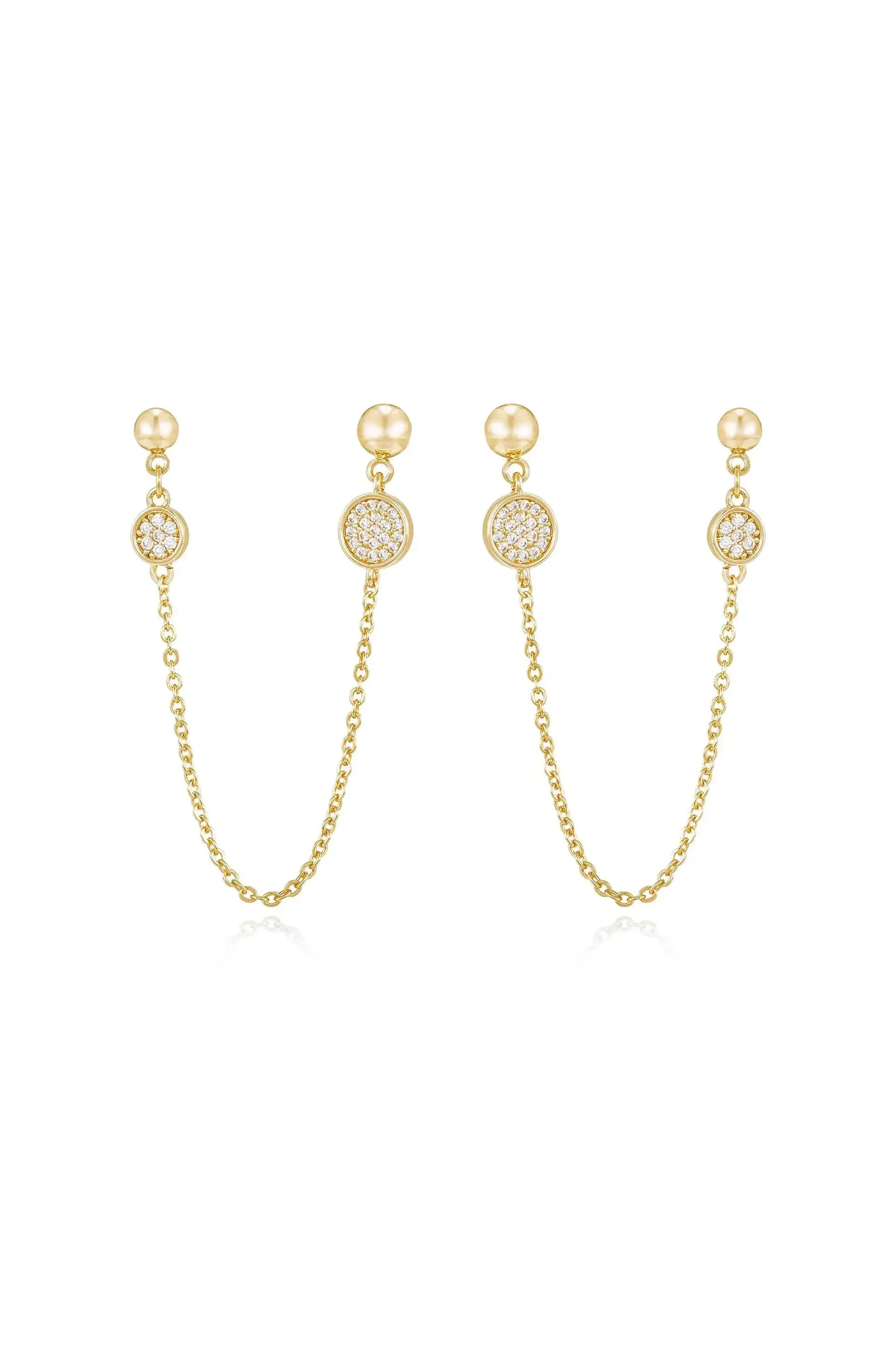 Gold earrings featuring two pendants connected by delicate chains. Each pendant has a central round design embellished with sparkling stones, reflecting light against a plain white background.