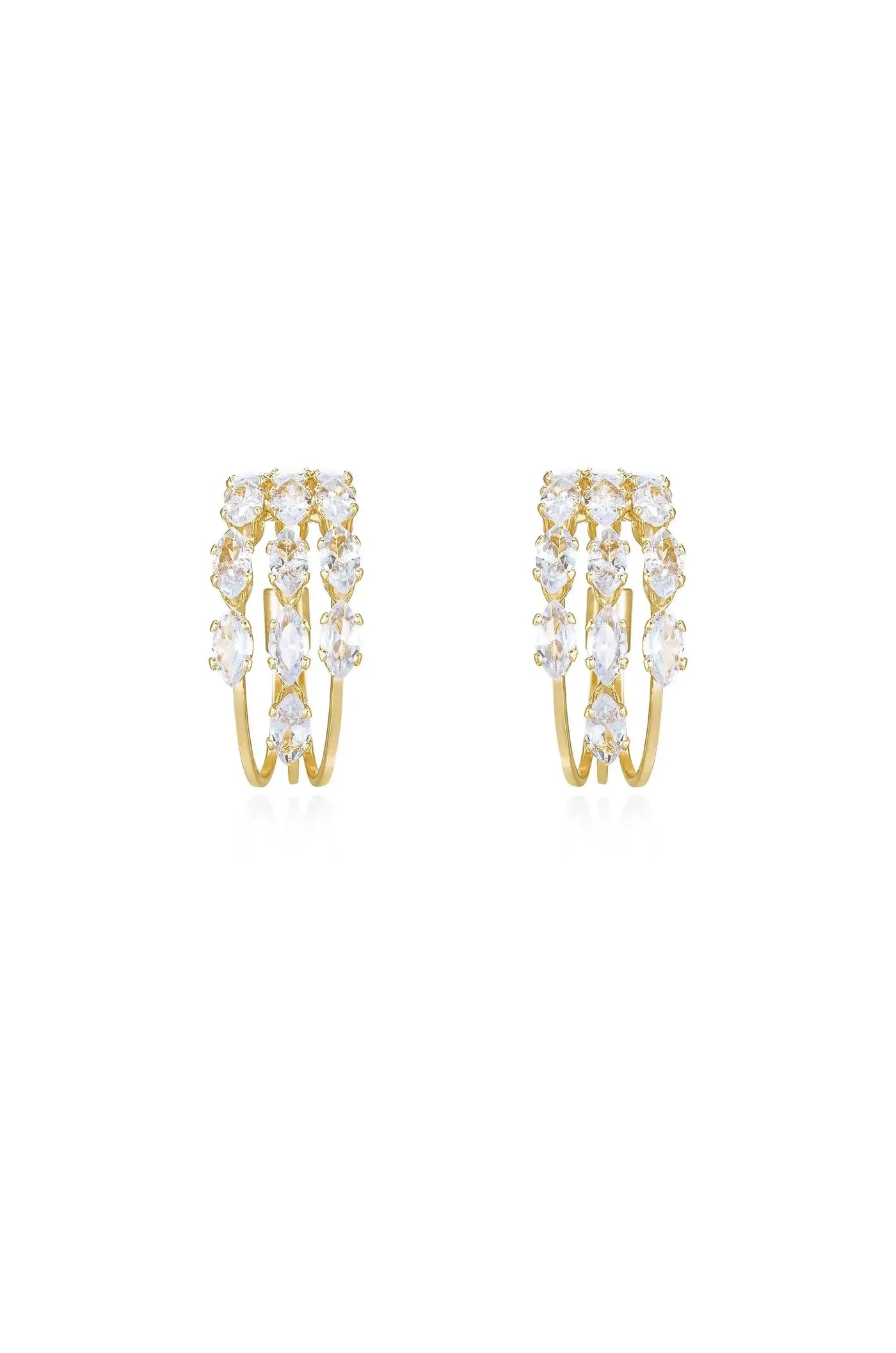 Gold hoop earrings adorned with multiple sparkling gemstones arranged in a cascading pattern, positioned against a clean, white background, showcasing their elegance and shine.