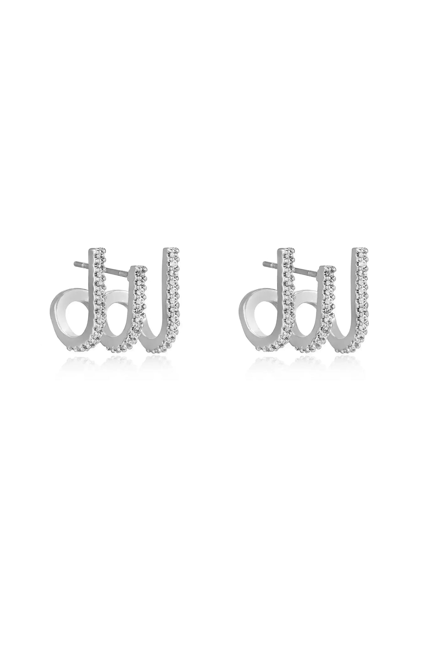 Silver earrings shaped like the letters "d" and "w," adorned with small sparkling stones. They are displayed against a plain white background.