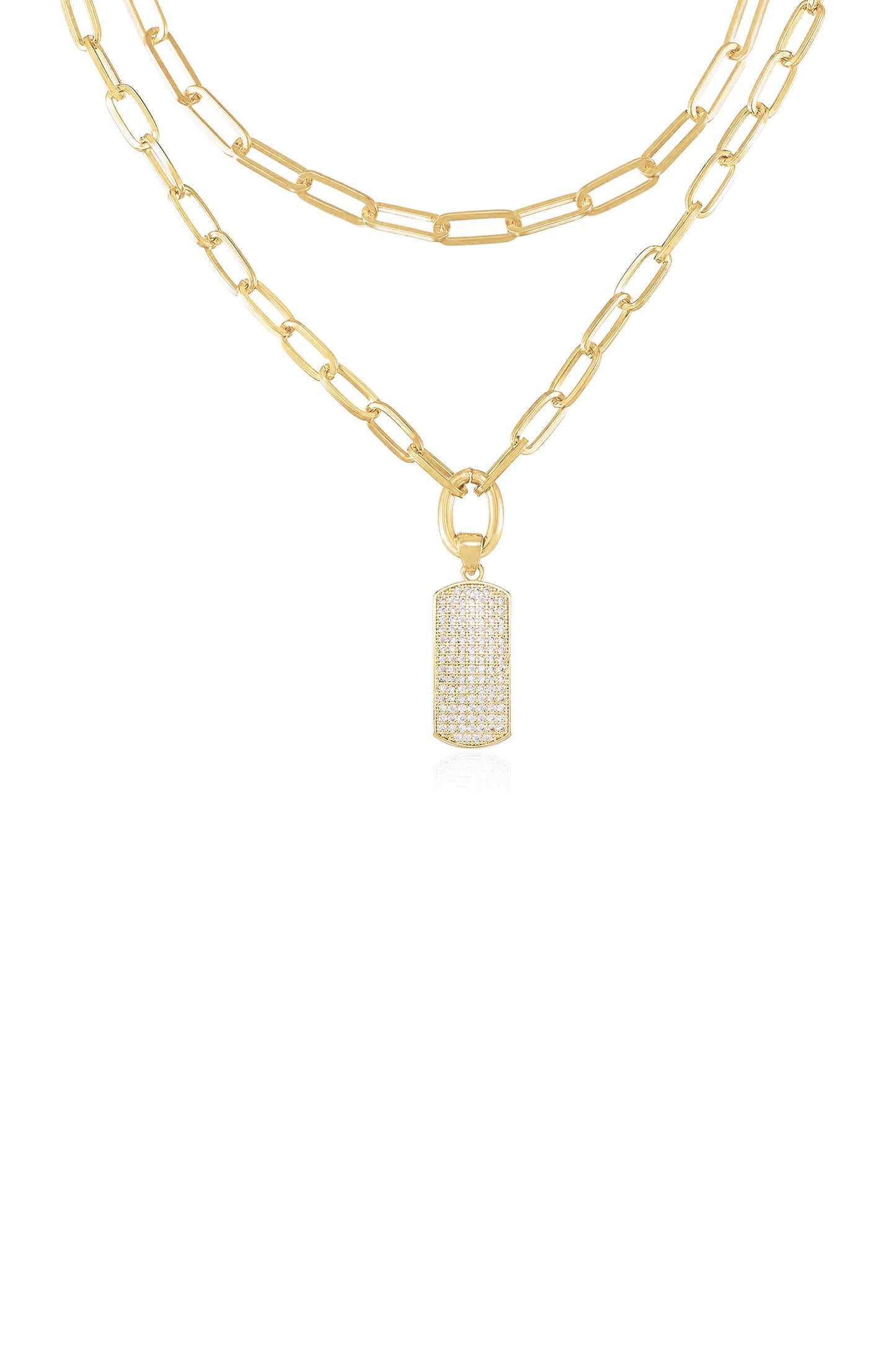 A gold layered necklace features elongated links and a cylindrical, sparkling pendant. The pendant hangs prominently in the center, emphasizing a stylish and luxurious look against a plain background.